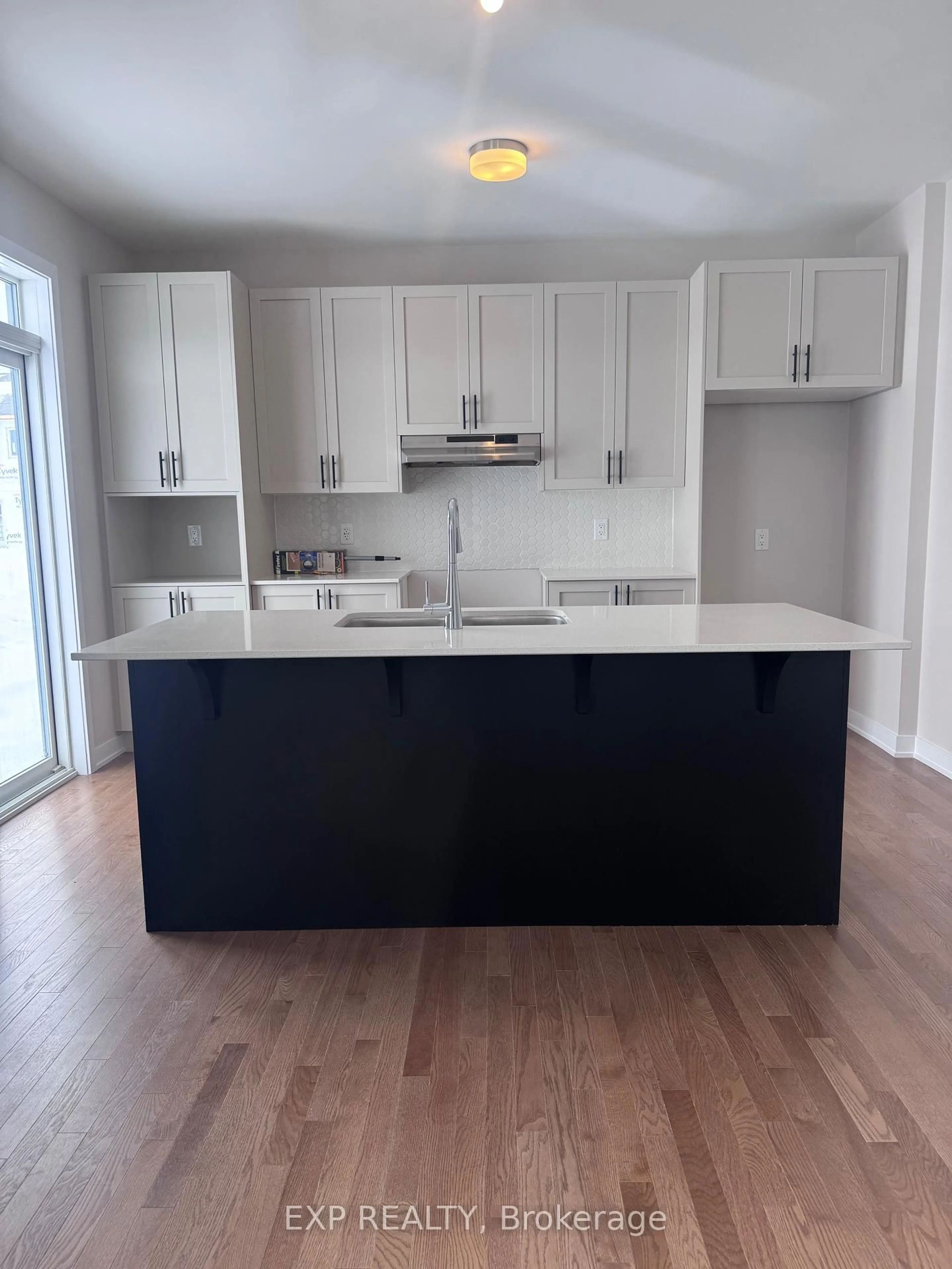 Open concept kitchen, wood/laminate floor for 170 Conservancy Dr, Barrhaven Ontario K2J 7L8