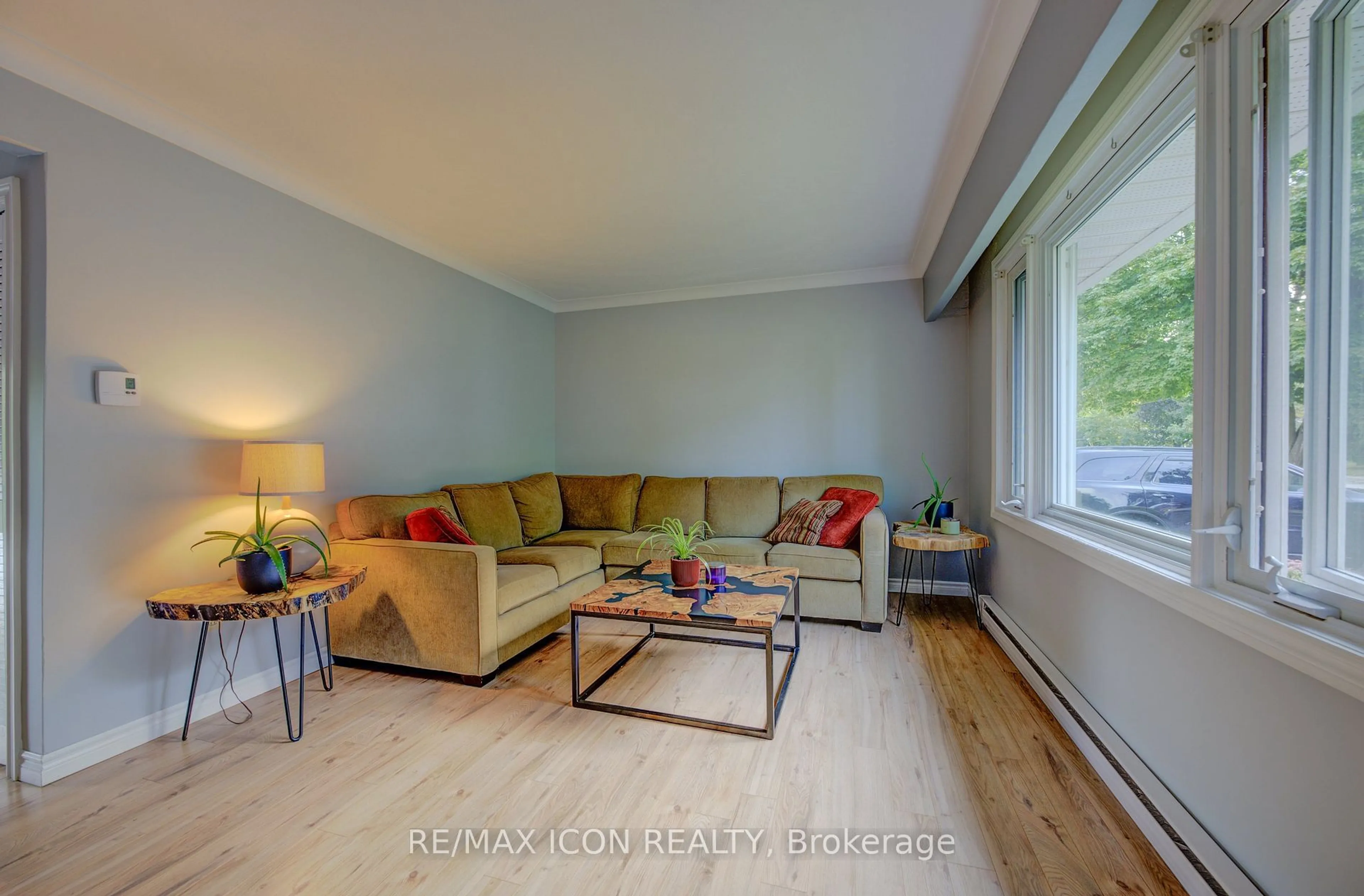 Living room with furniture, wood/laminate floor for 721 Waterloo St, Wellington North Ontario N0G 2L3