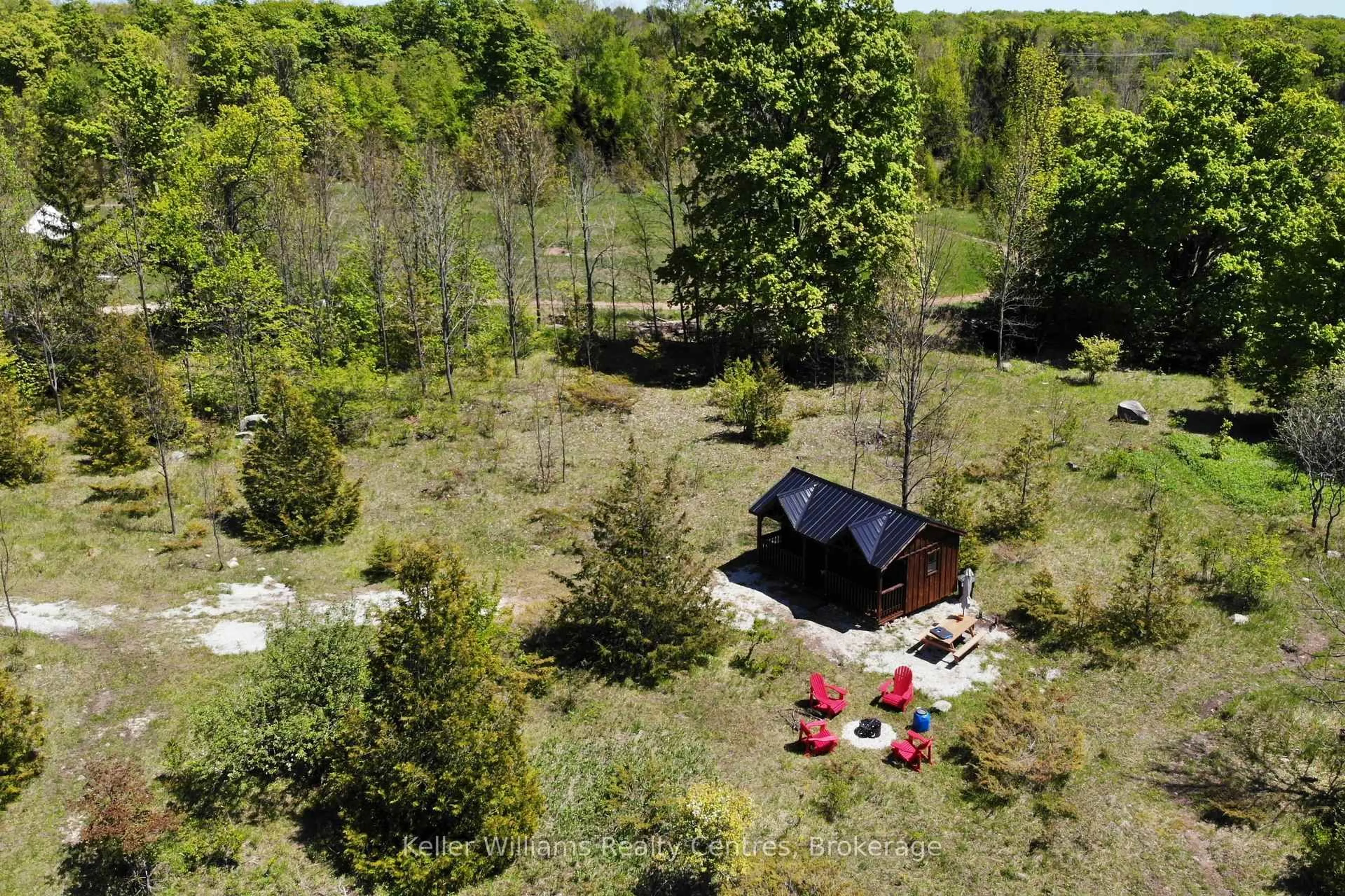 A pic from outside/outdoor area/front of a property/back of a property/a pic from drone, forest/trees view for 179482 Grey Road 17, Georgian Bluffs Ontario N0H 2T0