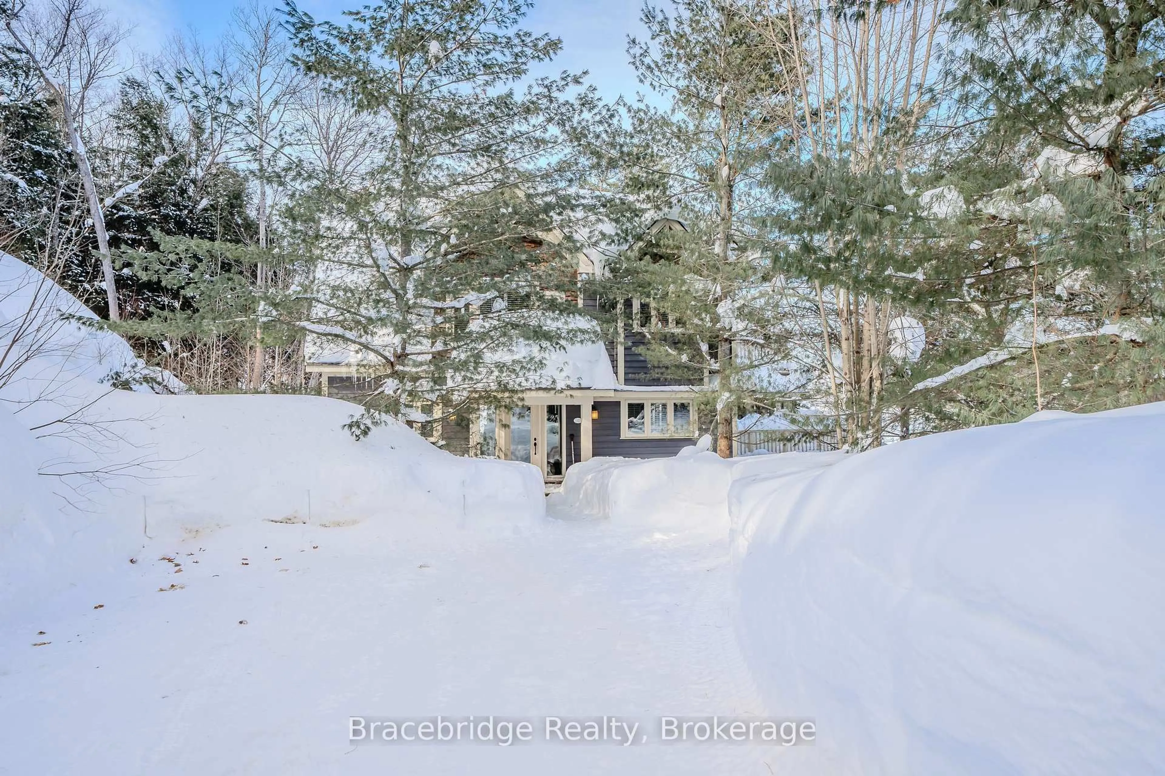 A pic from outside/outdoor area/front of a property/back of a property/a pic from drone, unknown for 3876 Muskoka Road 118 High #Water's Edge W1, Muskoka Lakes Ontario P0B 1J0