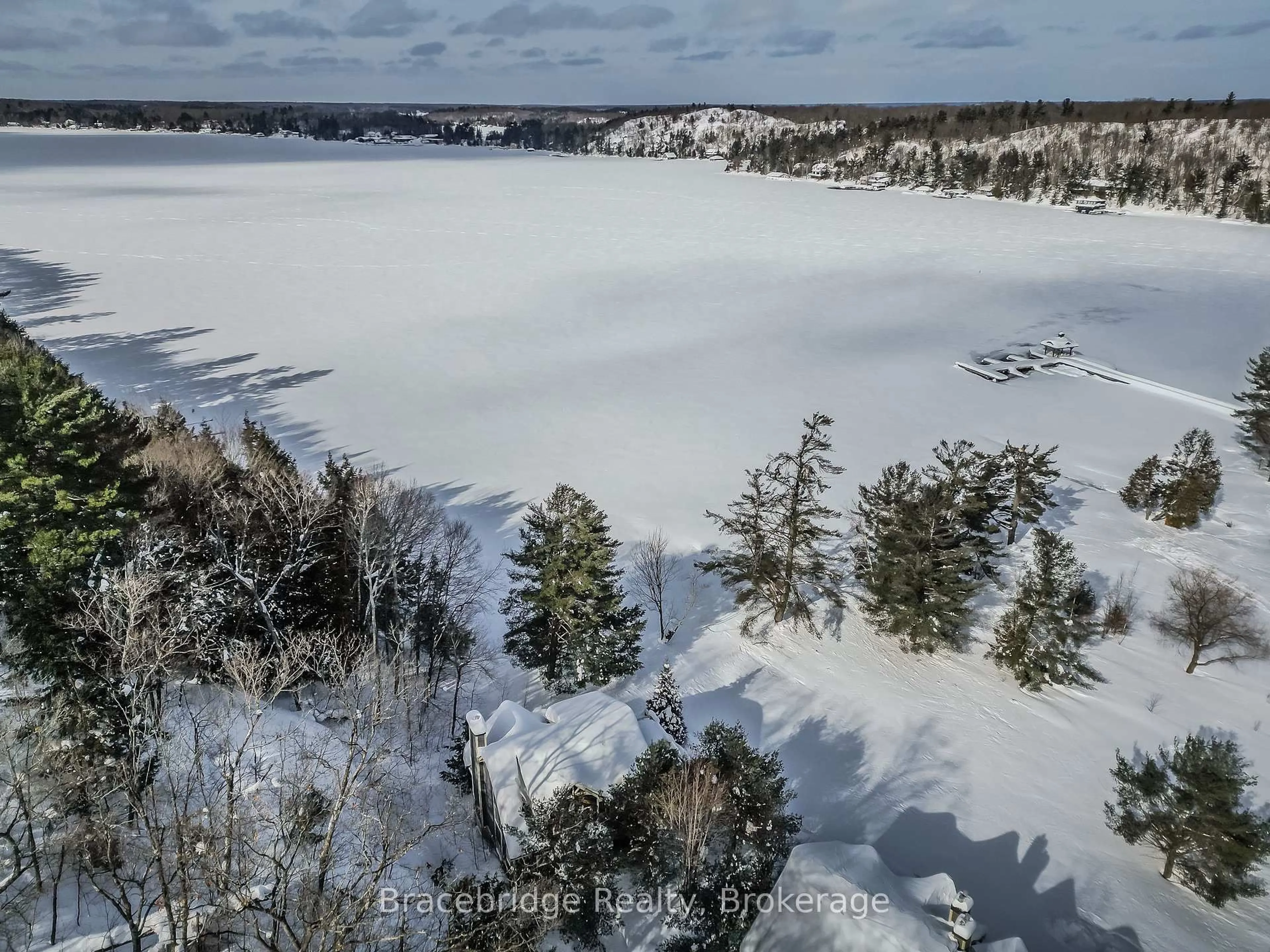 A pic from outside/outdoor area/front of a property/back of a property/a pic from drone, water/lake/river/ocean view for 3876 Muskoka Road 118 High #Water's Edge W1, Muskoka Lakes Ontario P0B 1J0