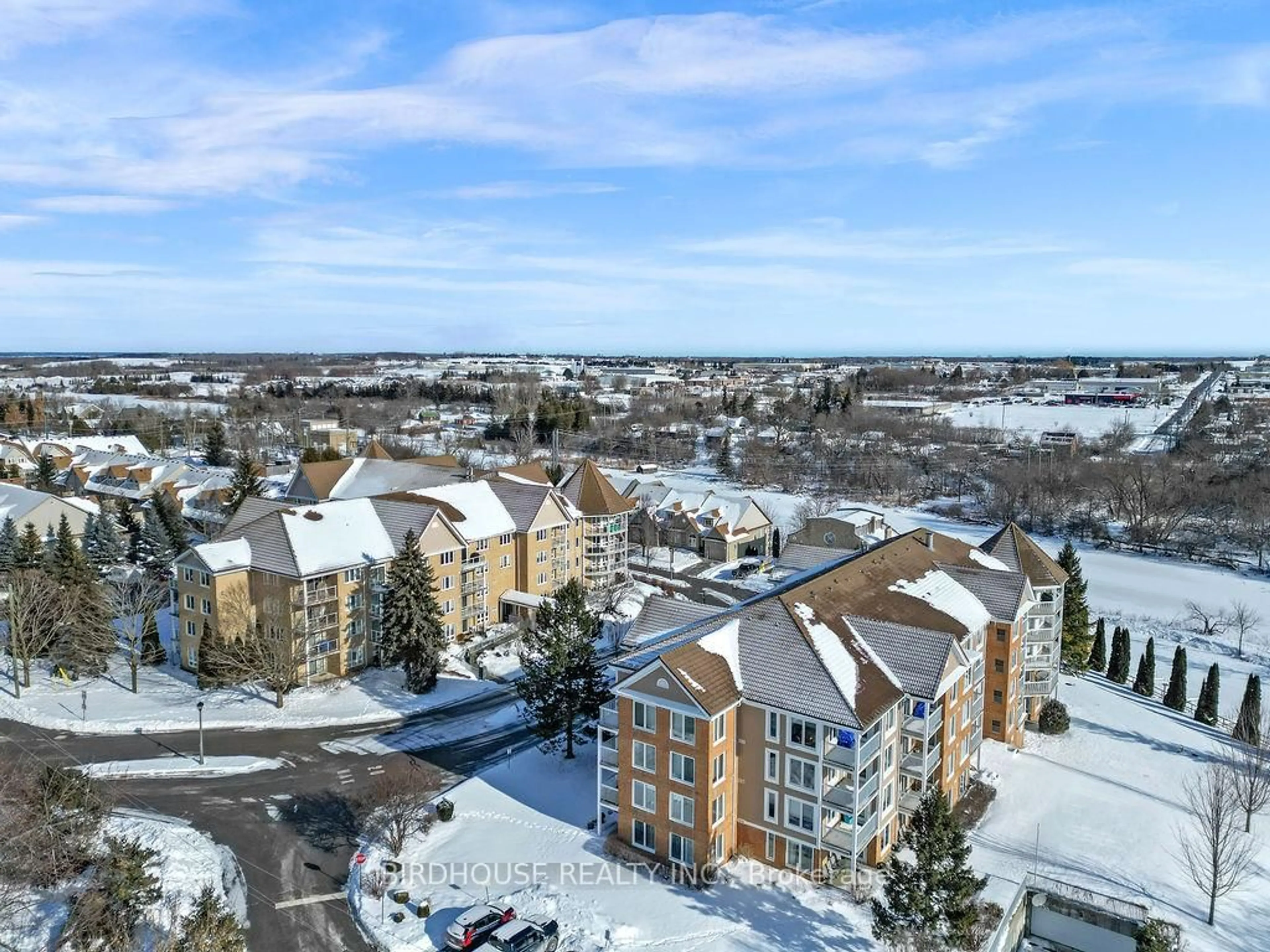 A pic from outside/outdoor area/front of a property/back of a property/a pic from drone, city buildings view from balcony for 50 Rivermill Blvd #204, Kawartha Lakes Ontario K9V 6C1