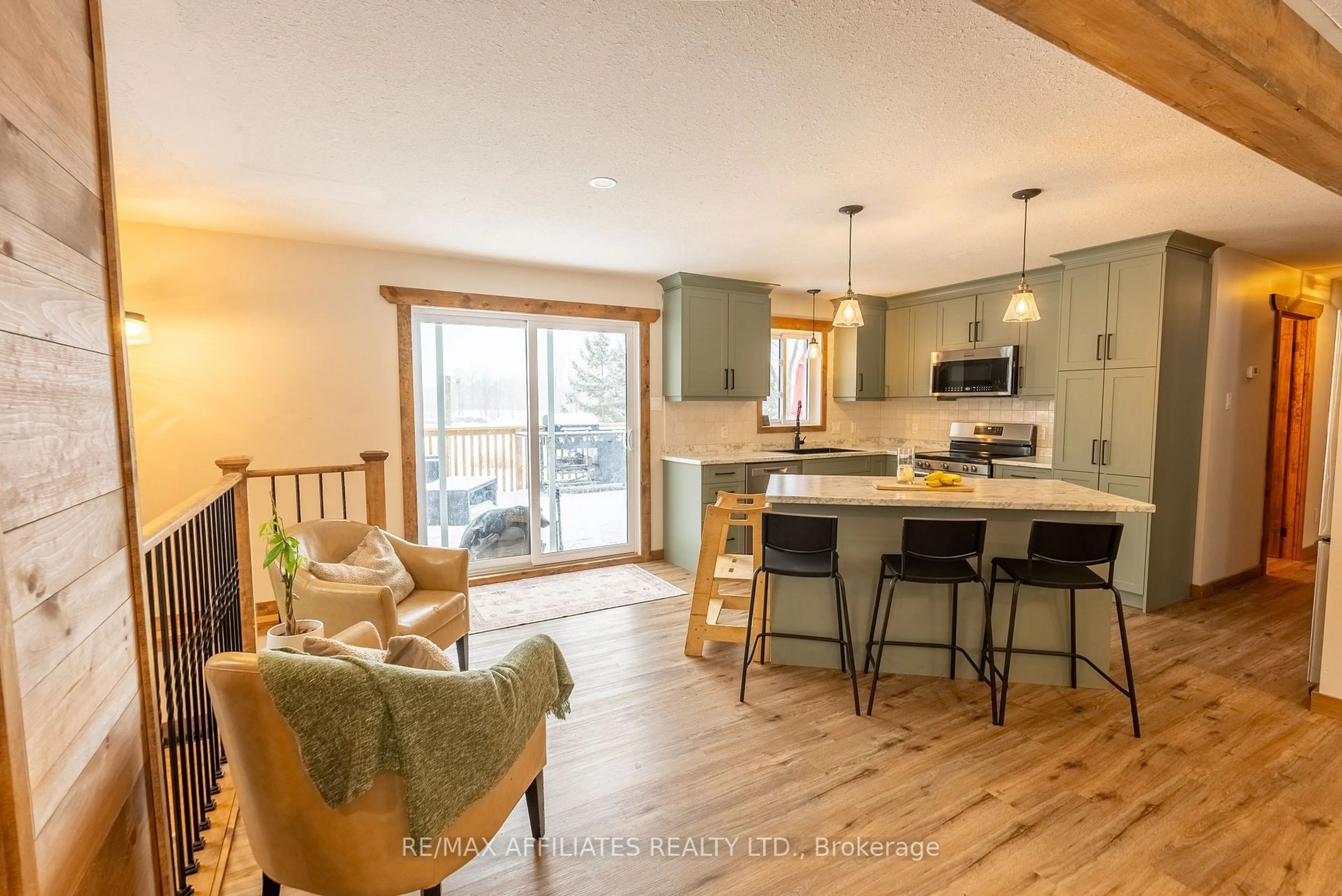 Open concept kitchen, wood/laminate floor for 480 Porter Rd, Rideau Lakes Ontario K0G 1X0