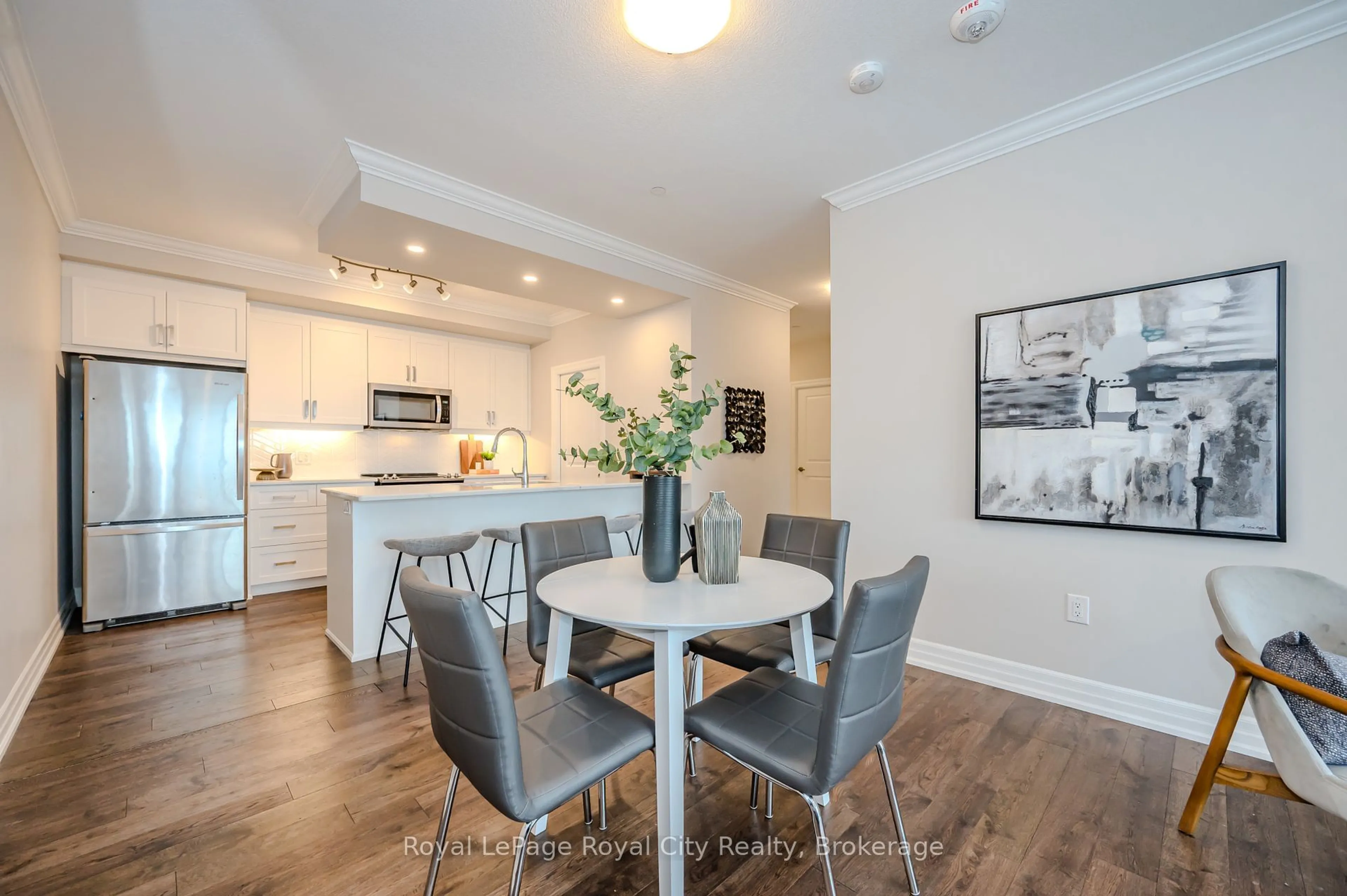 Open concept kitchen, wood/laminate floor for 1878 Gordon St #1001, Guelph Ontario N1L 0P4