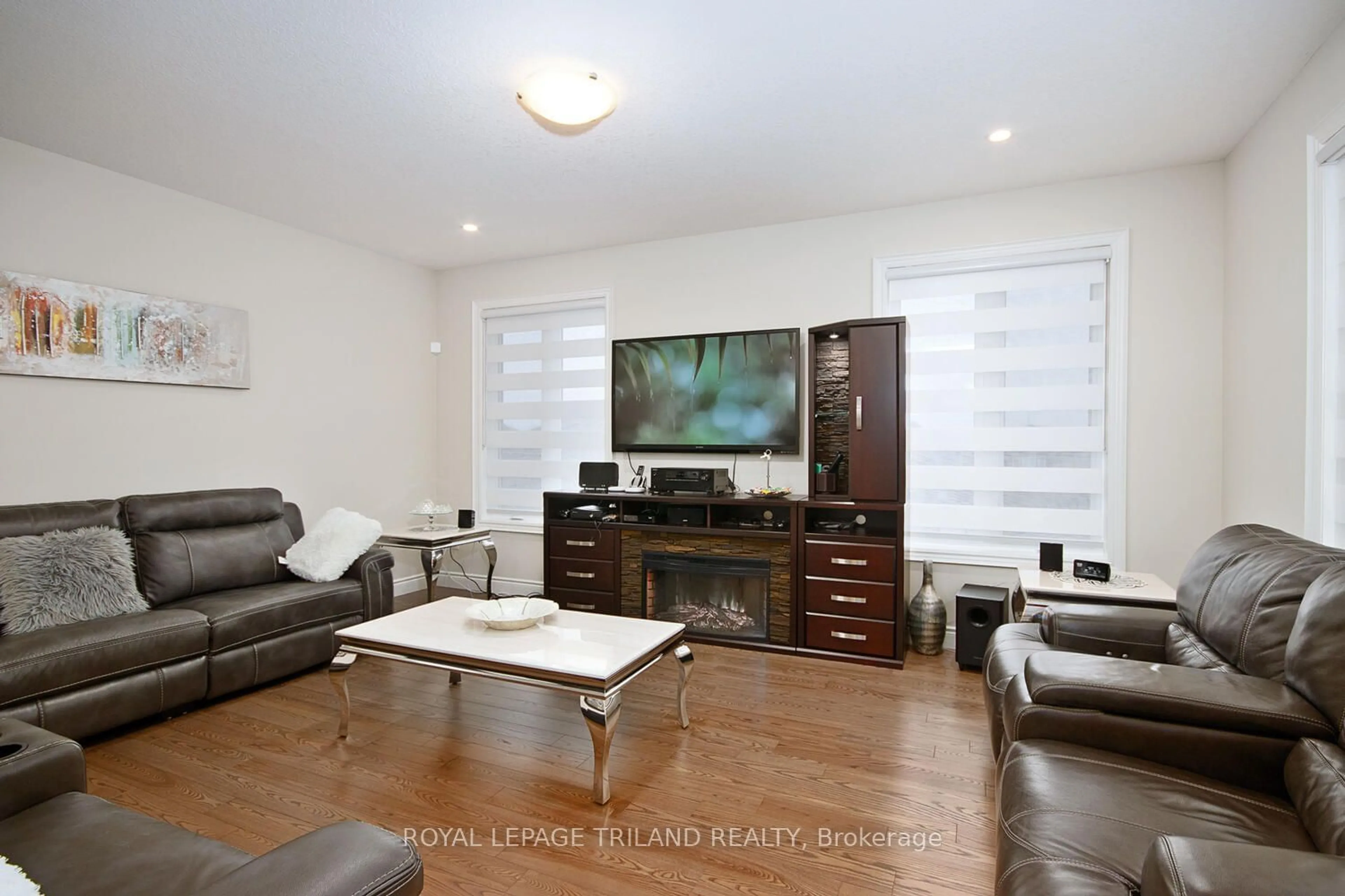 Living room with furniture, wood/laminate floor for 2544 Holbrook Dr, London Ontario N6M 1G5