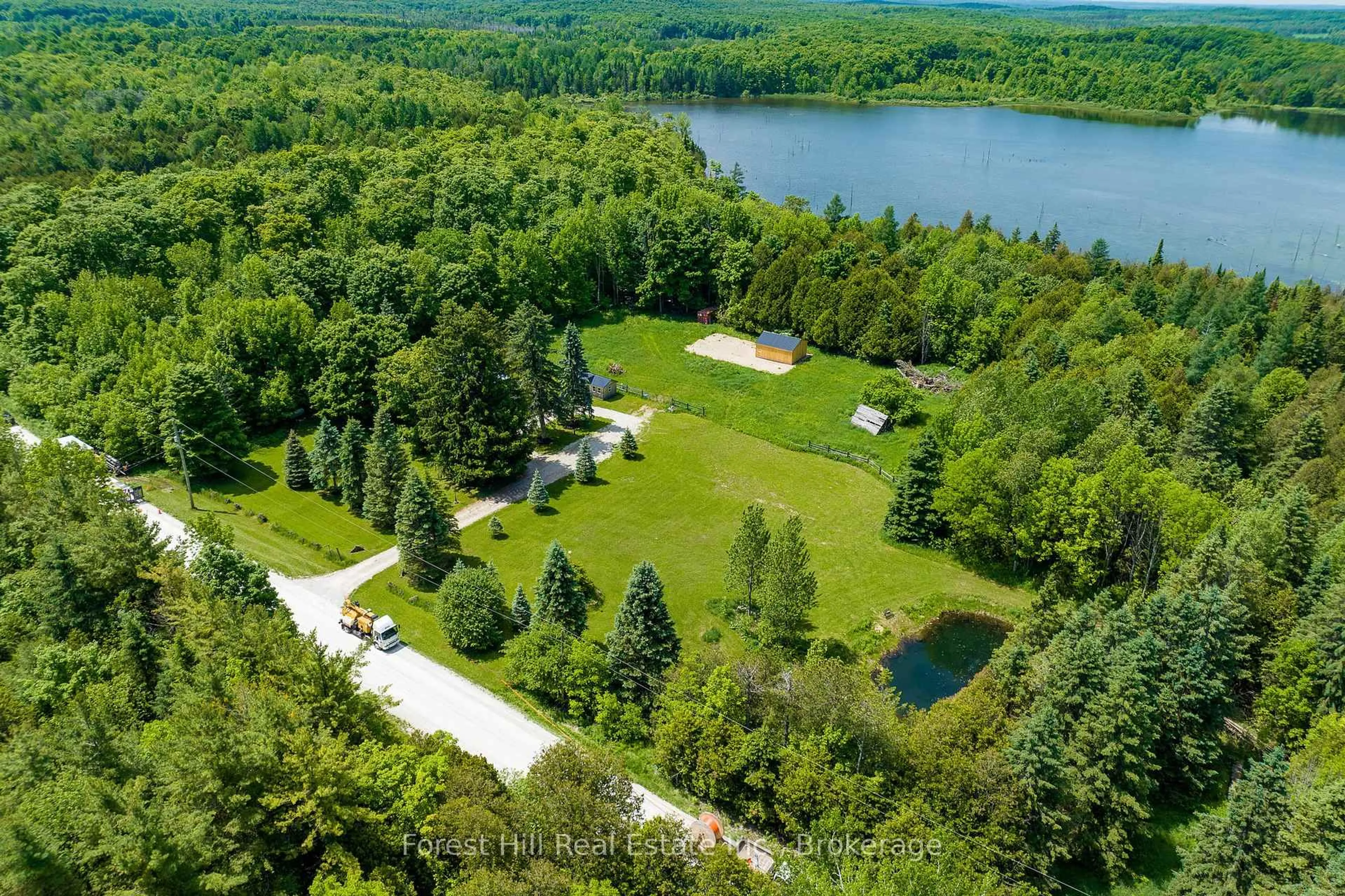 A pic from outside/outdoor area/front of a property/back of a property/a pic from drone, water/lake/river/ocean view for 555262 6th Line, Blue Mountains Ontario N0H 2E0