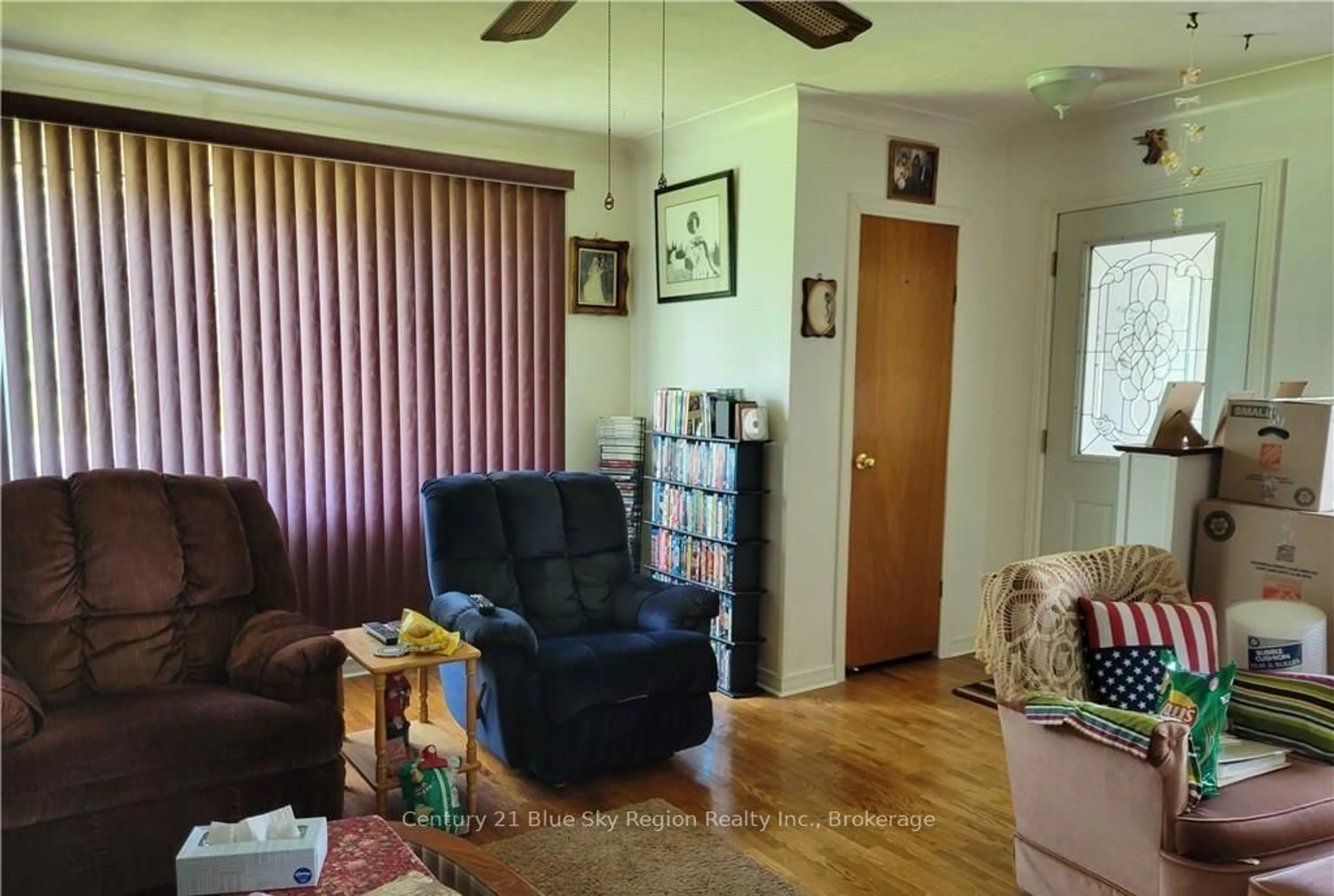 Living room with furniture, wood/laminate floor for 405 HIGHWAY 654, Callander Ontario P0H 1H0