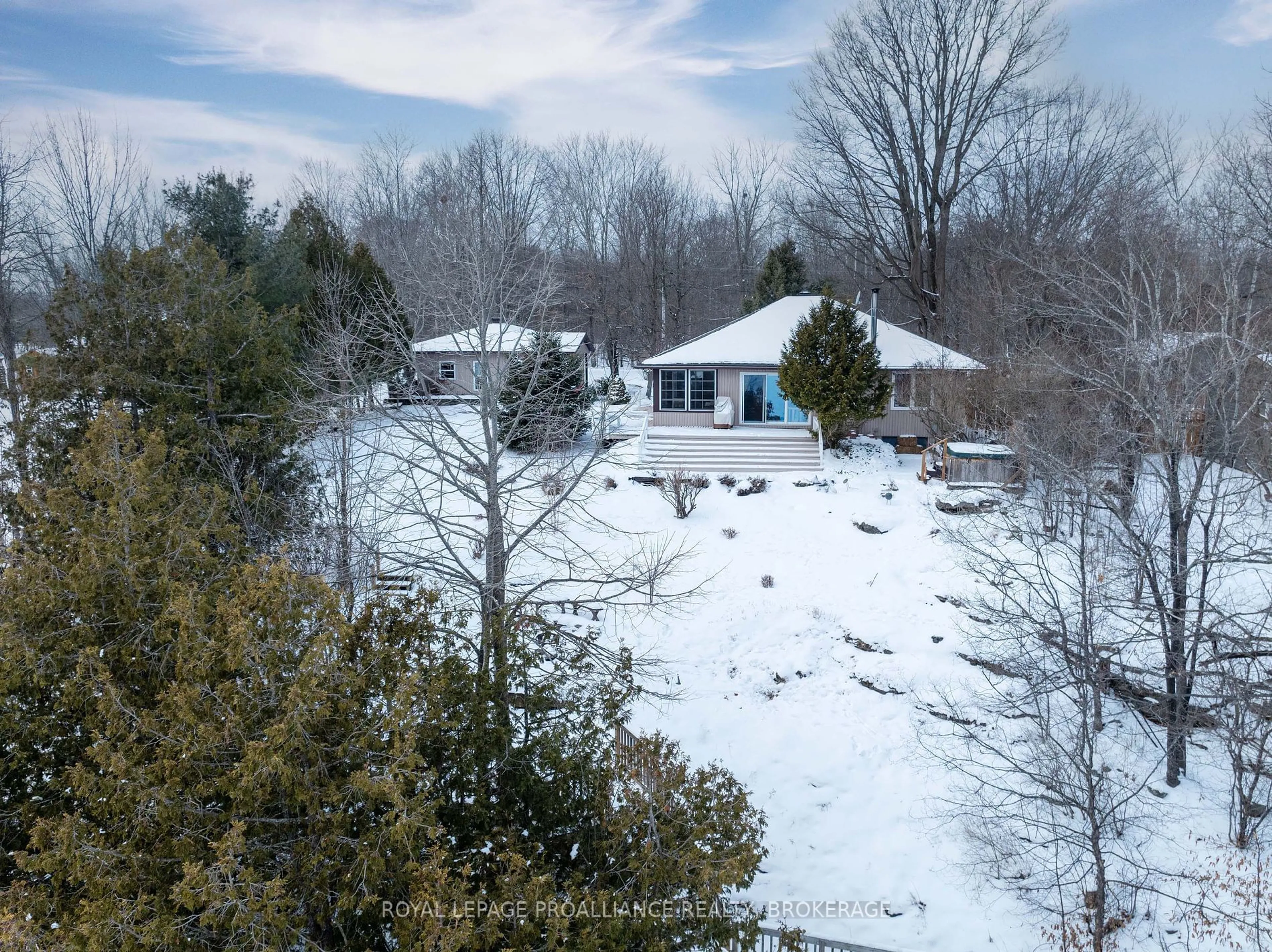 A pic from outside/outdoor area/front of a property/back of a property/a pic from drone, forest/trees view for 211 McBride Point Dr, Rideau Lakes Ontario K0G 1X0