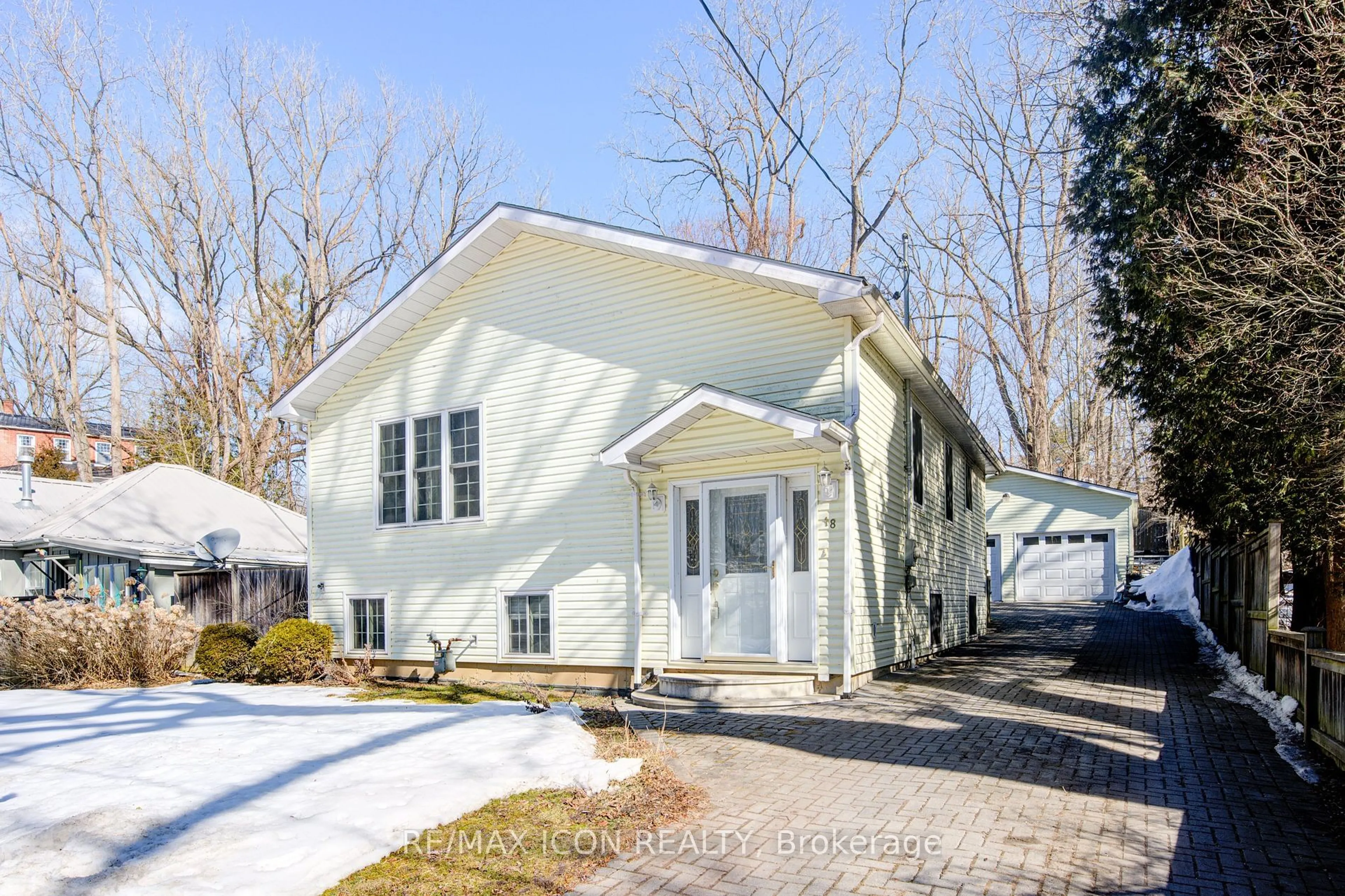 Home with vinyl exterior material, street for 18 Commercial Rd, Norfolk Ontario N3Y 4K2