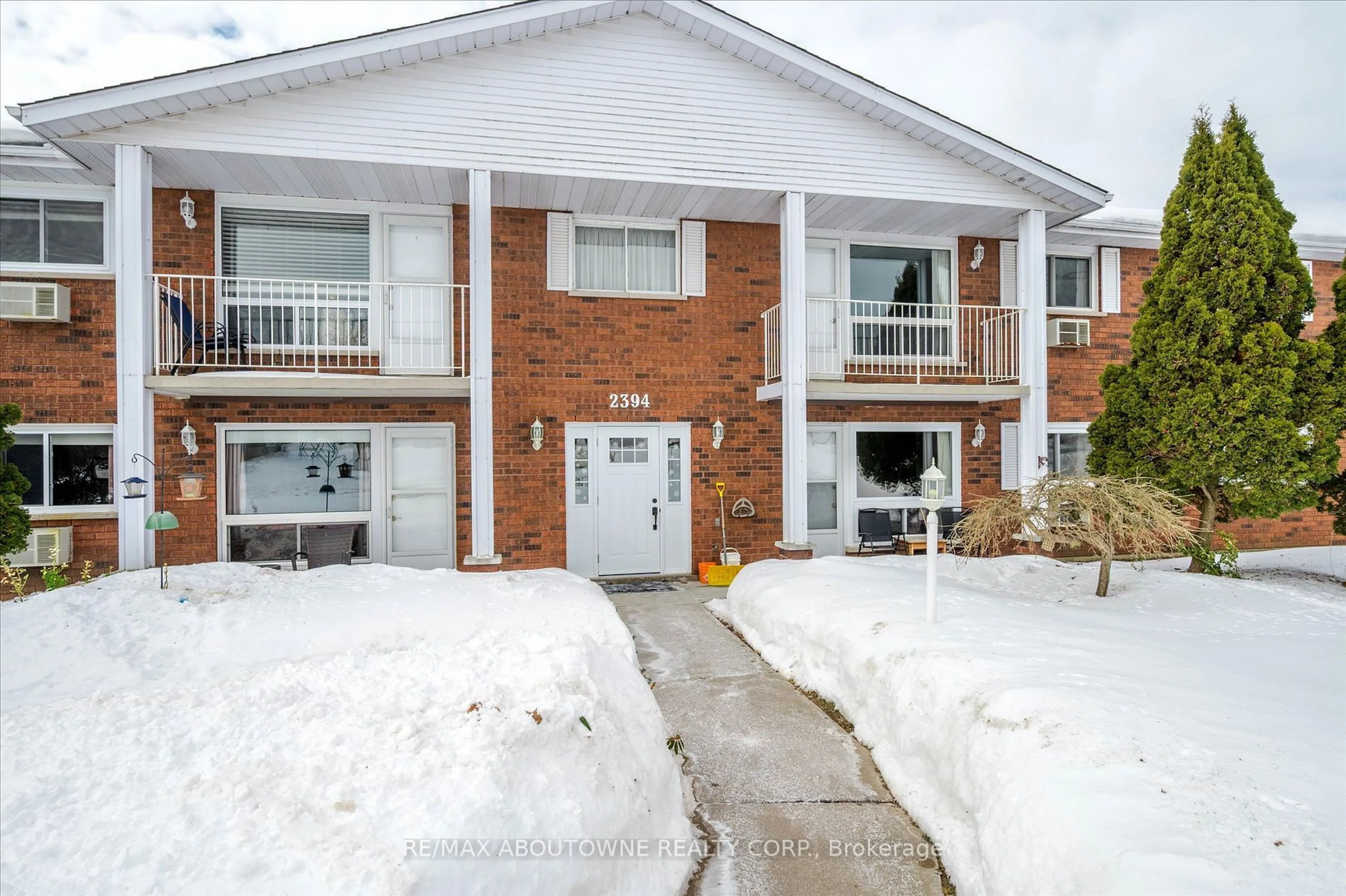 Home with brick exterior material, street for 2394 Mountland Dr #201, Peterborough Ontario K9K 2C9