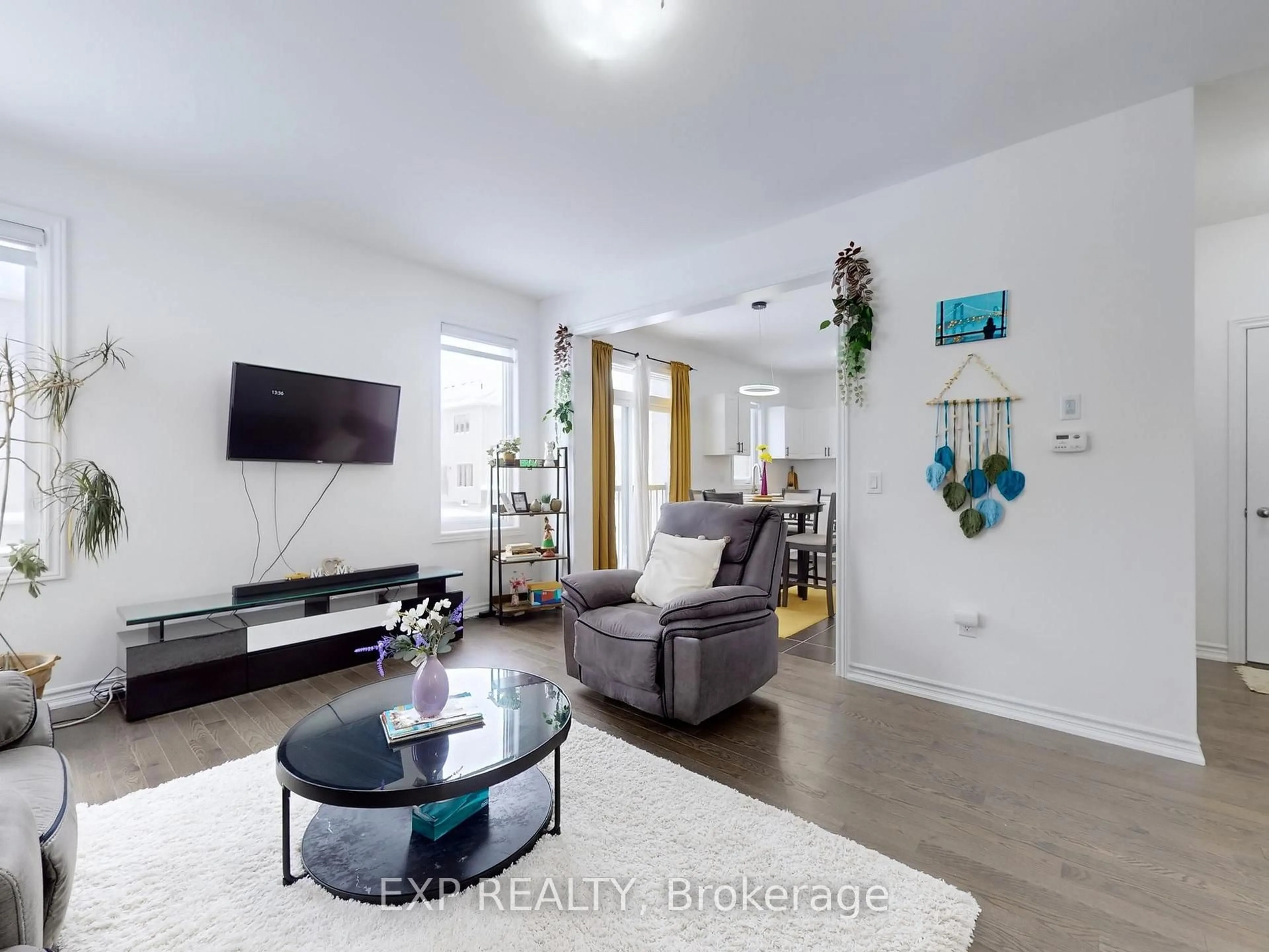 Living room with furniture, wood/laminate floor for 32 Doc Lougheed Ave, Southgate Ontario N0C 1B0