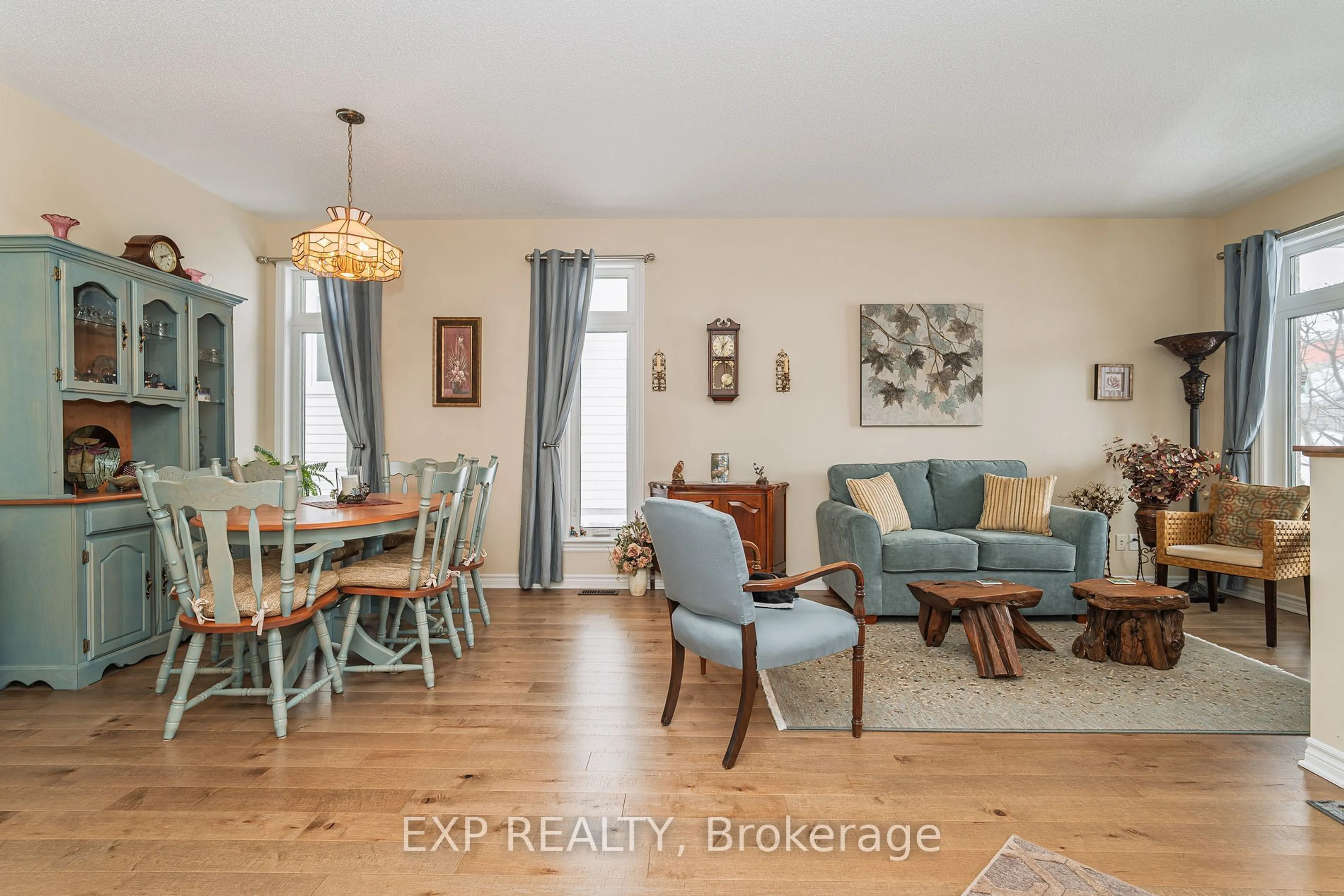 Living room with furniture, wood/laminate floor for 208 Voie De Brouage Way, Orleans - Cumberland and Area Ontario K4A 0Y5