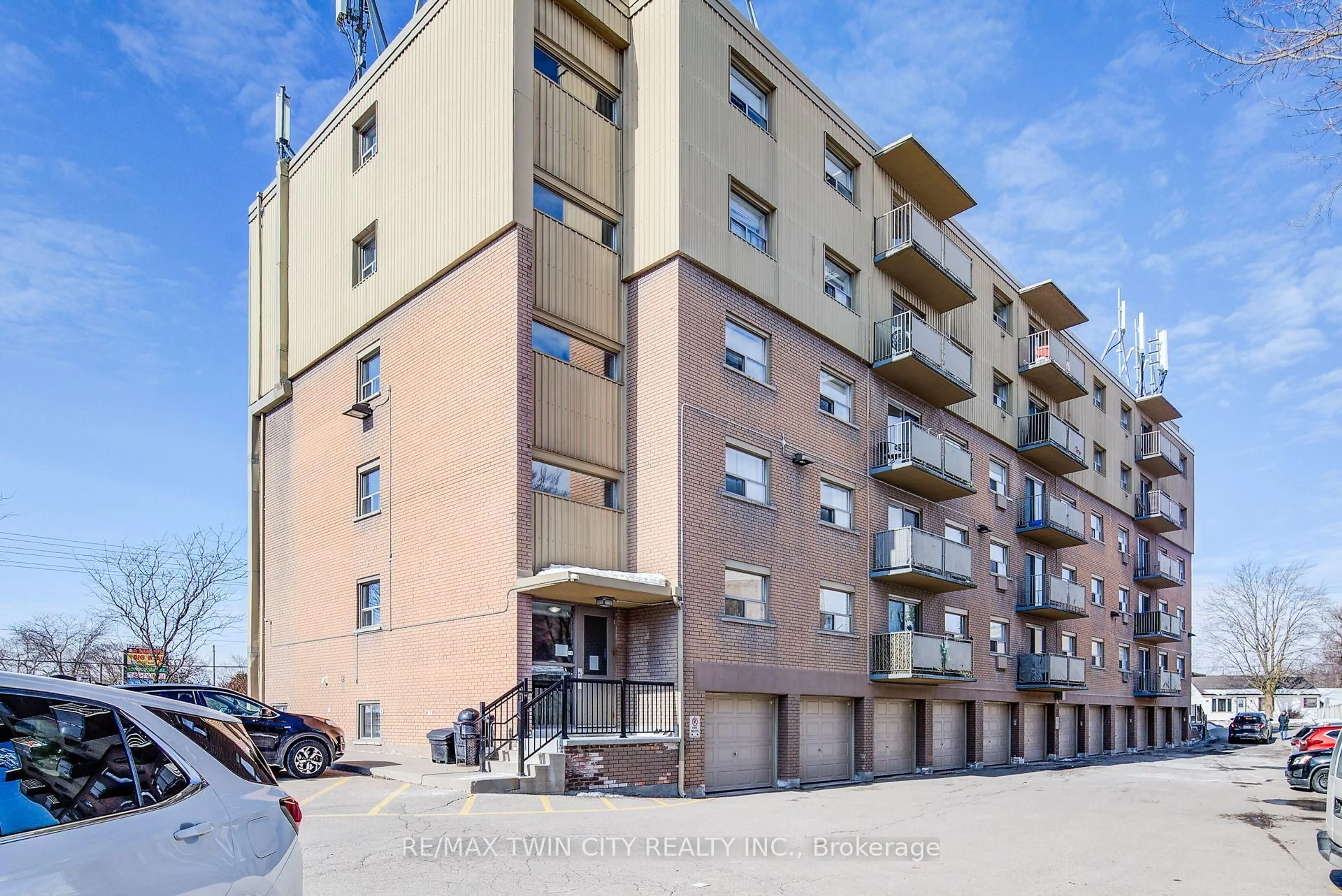 A pic from outside/outdoor area/front of a property/back of a property/a pic from drone, street for 283 Fairway Rd #202, Kitchener Ontario N2A 2P1