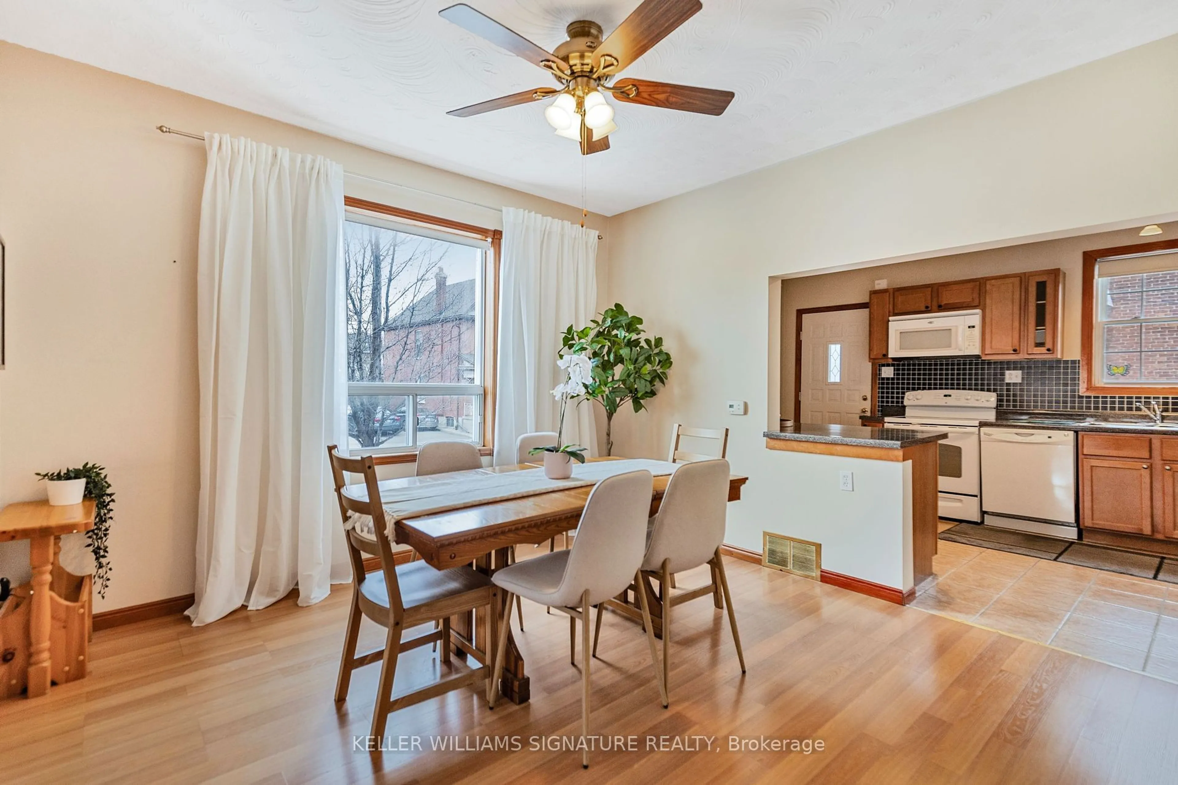 Dining room, wood/laminate floor for 54 Sherman Ave, Hamilton Ontario L8L 6L8