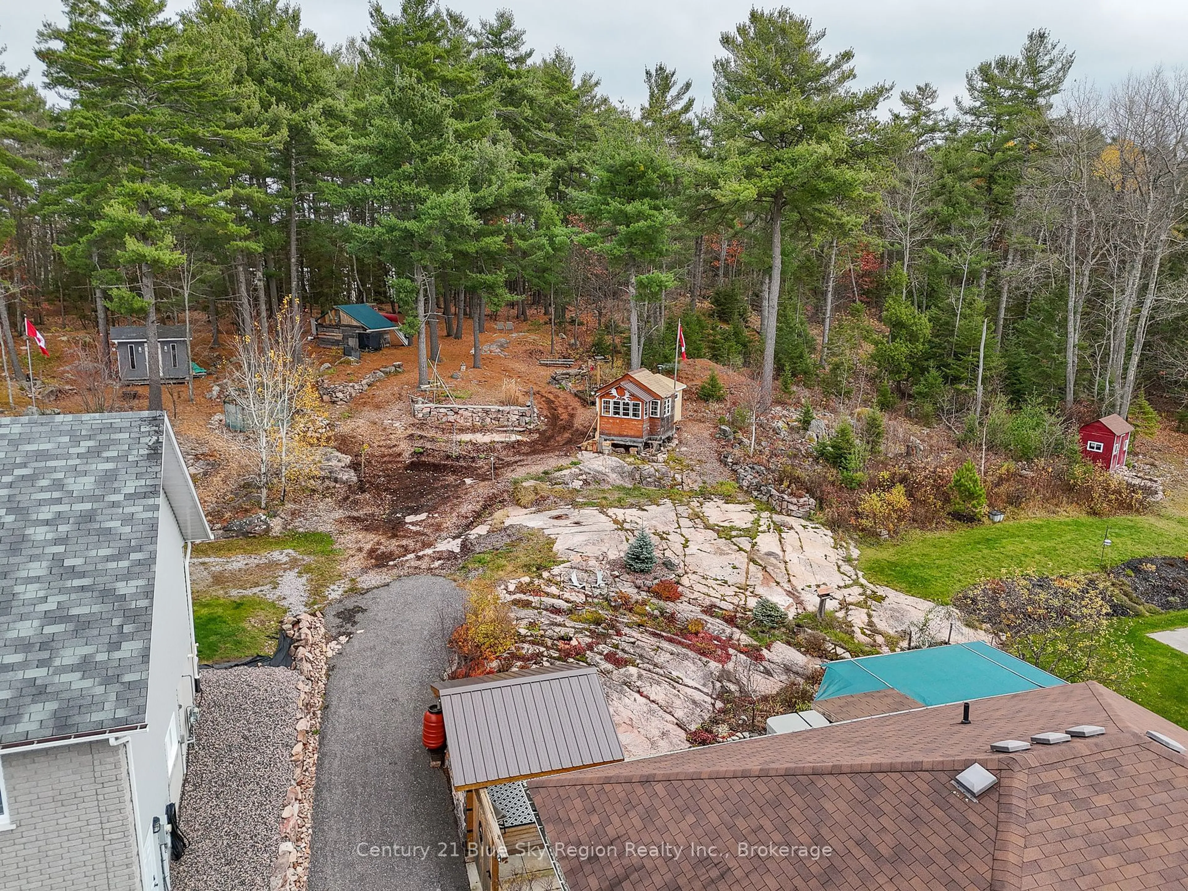 A pic from outside/outdoor area/front of a property/back of a property/a pic from drone, forest/trees view for 152 FAIRWAY Dr, Callander Ontario P0H 1H0