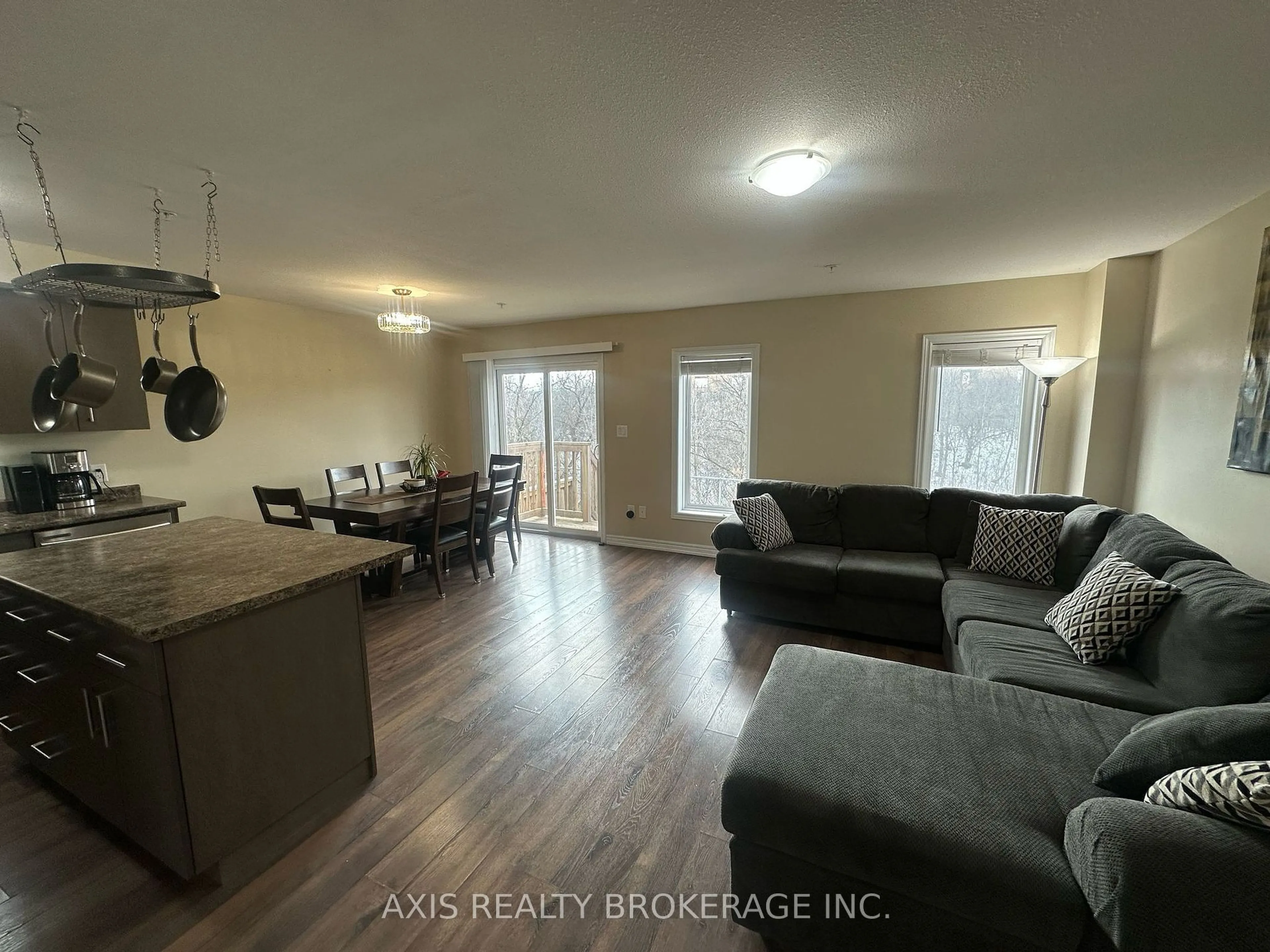 Living room with furniture, wood/laminate floor for 60 Canterbury Dr #23, St. Catharines Ontario L2P 3M8