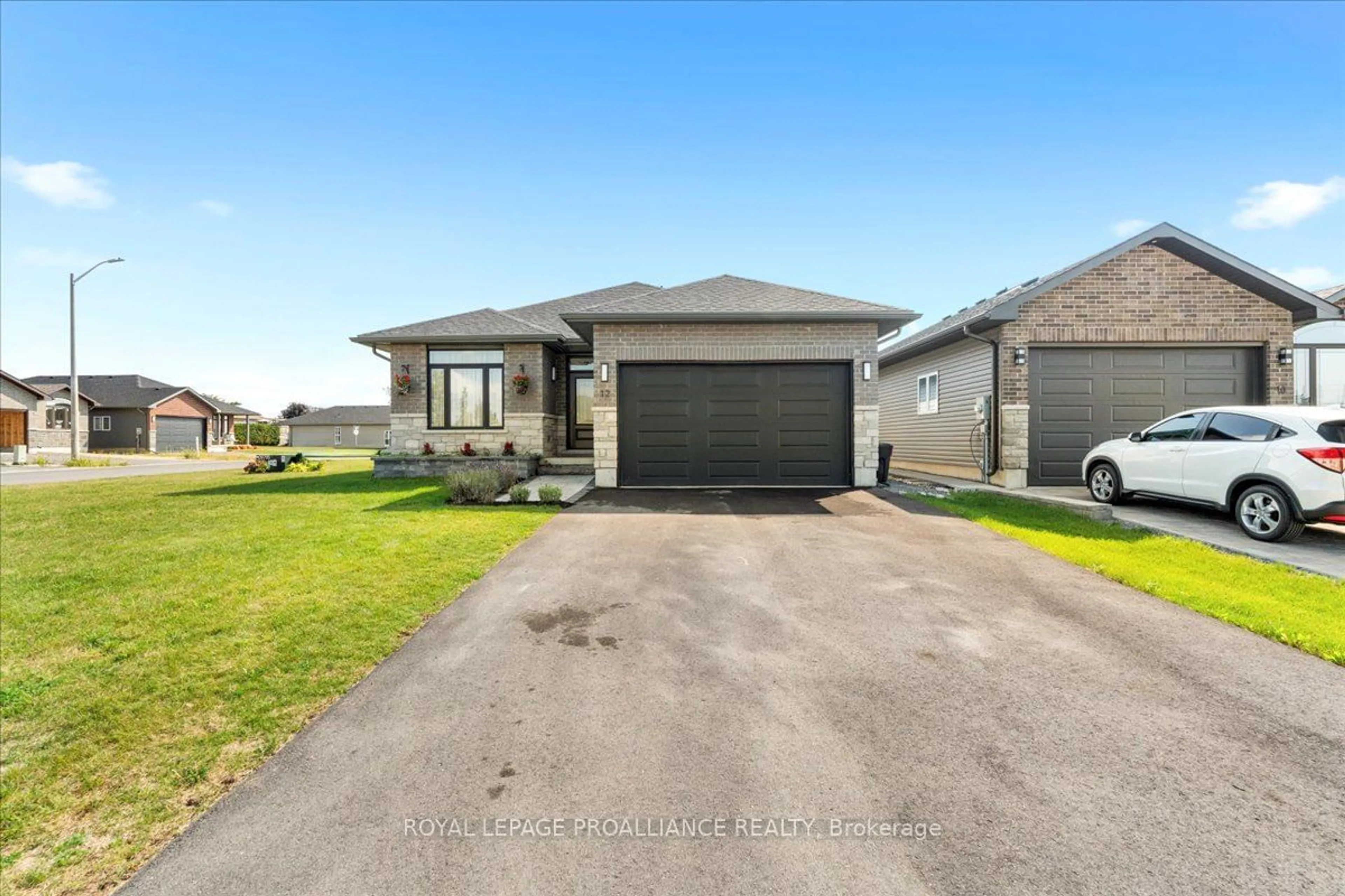 A pic from outside/outdoor area/front of a property/back of a property/a pic from drone, street for 12 Matheos Cres, Quinte West Ontario K8V 0L2