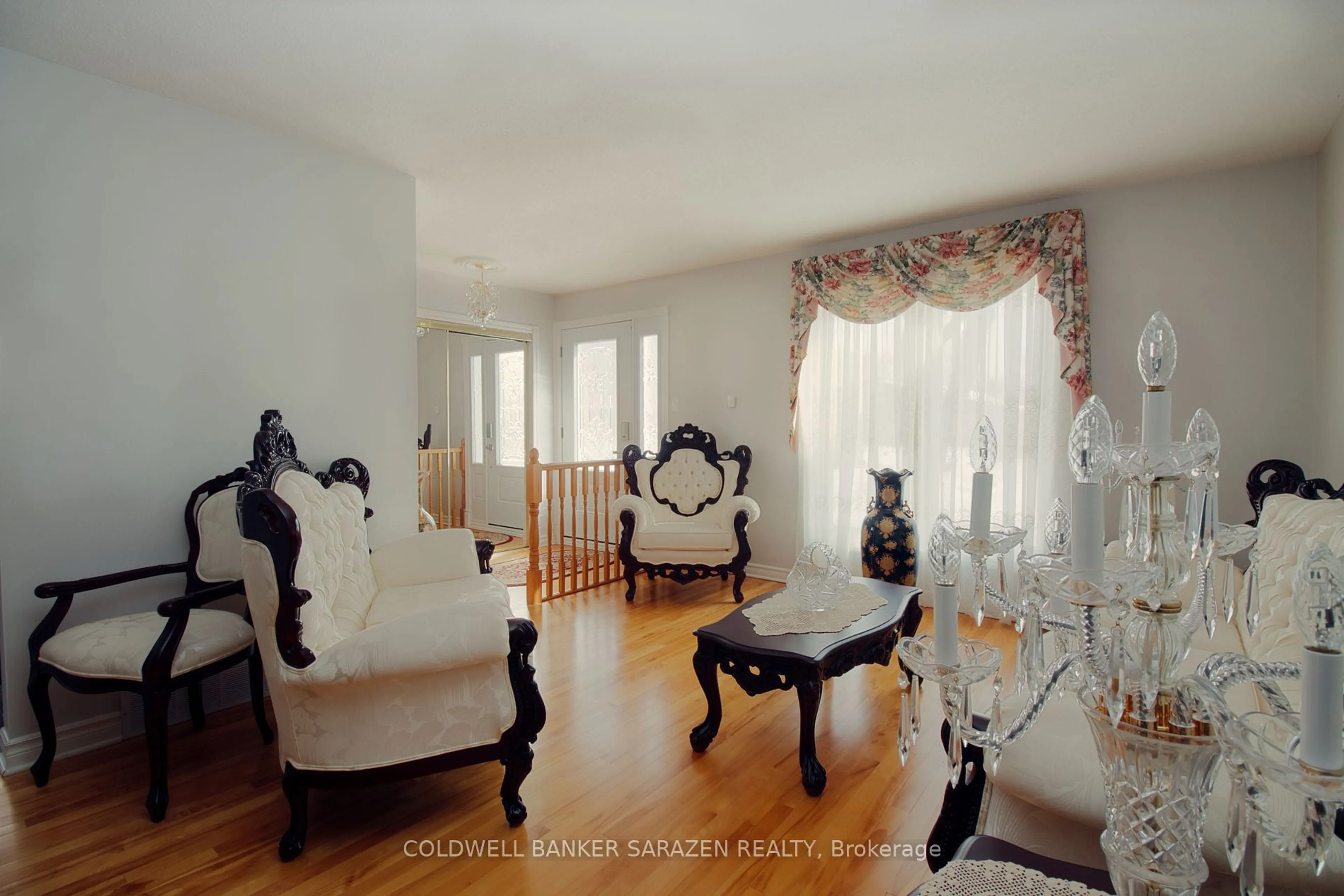 Living room with furniture, wood/laminate floor for 2435 Heaton Ave, Ottawa Ontario K1G 1J1
