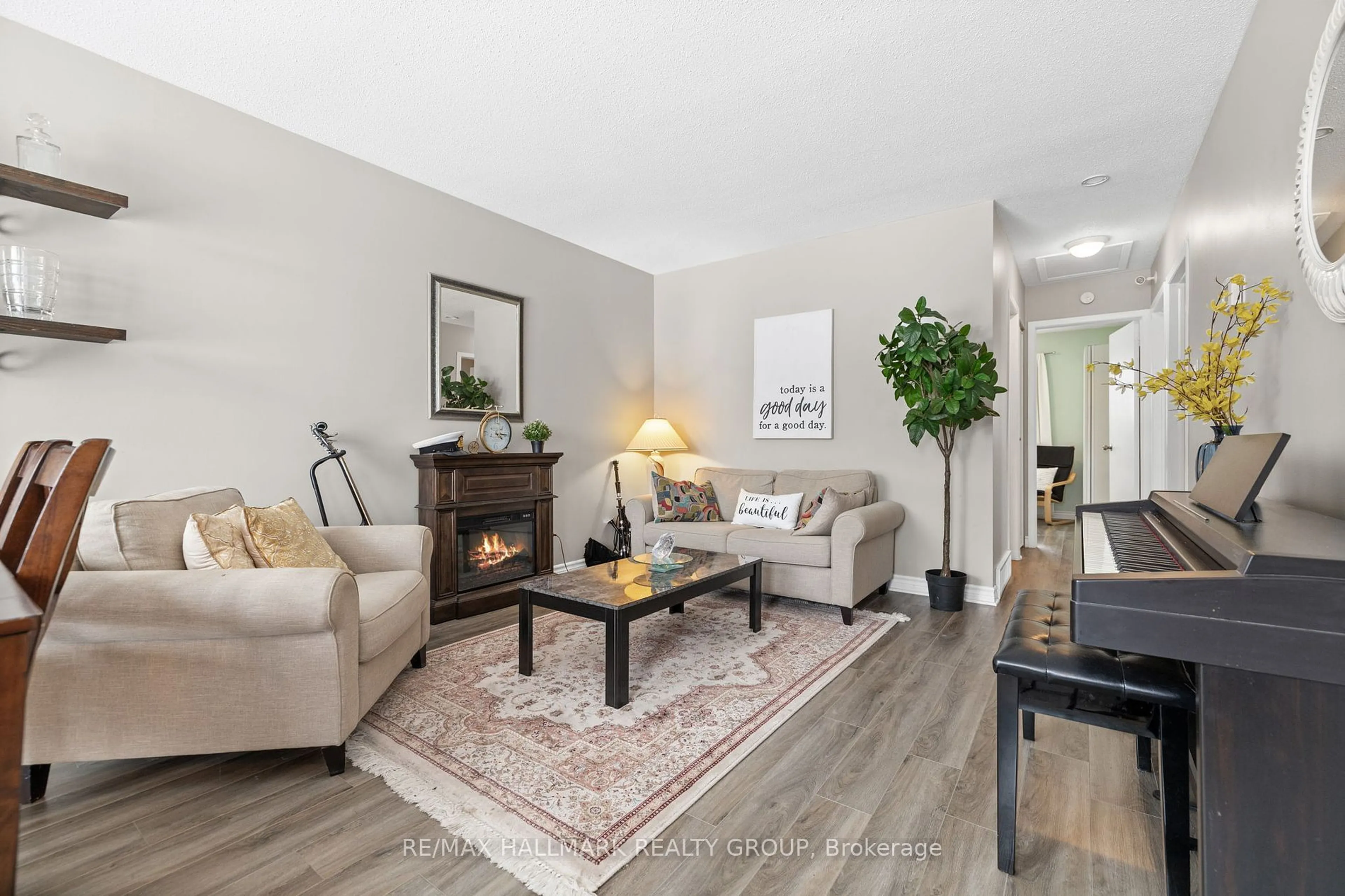 Living room with furniture, wood/laminate floor for 40 Morton Dr, Kanata Ontario K2L 1X1