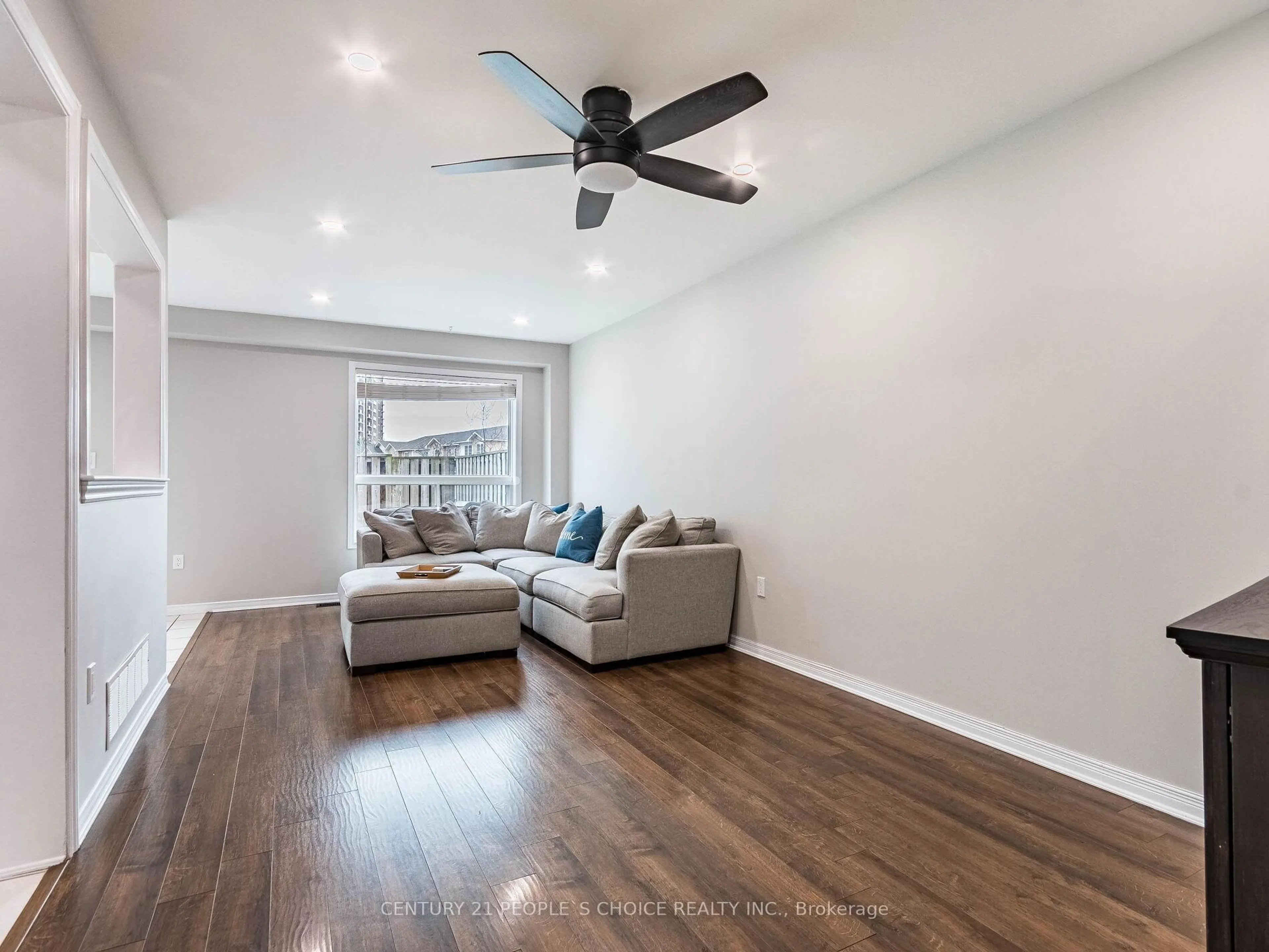 Living room with furniture, wood/laminate floor for 485 Green Rd #79, Hamilton Ontario L8E 6A9