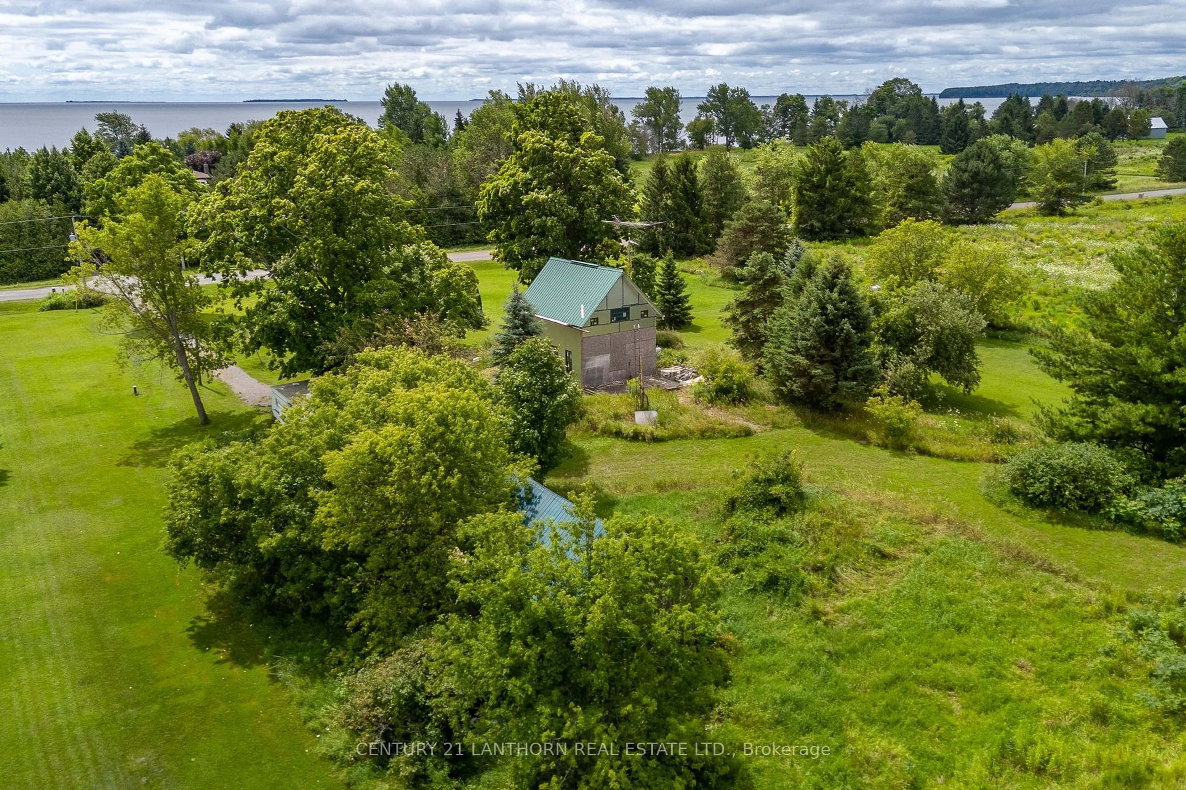 A pic from outside/outdoor area/front of a property/back of a property/a pic from drone, water/lake/river/ocean view for 4805 County Road 8 Rd, Prince Edward County Ontario K0K 2T0