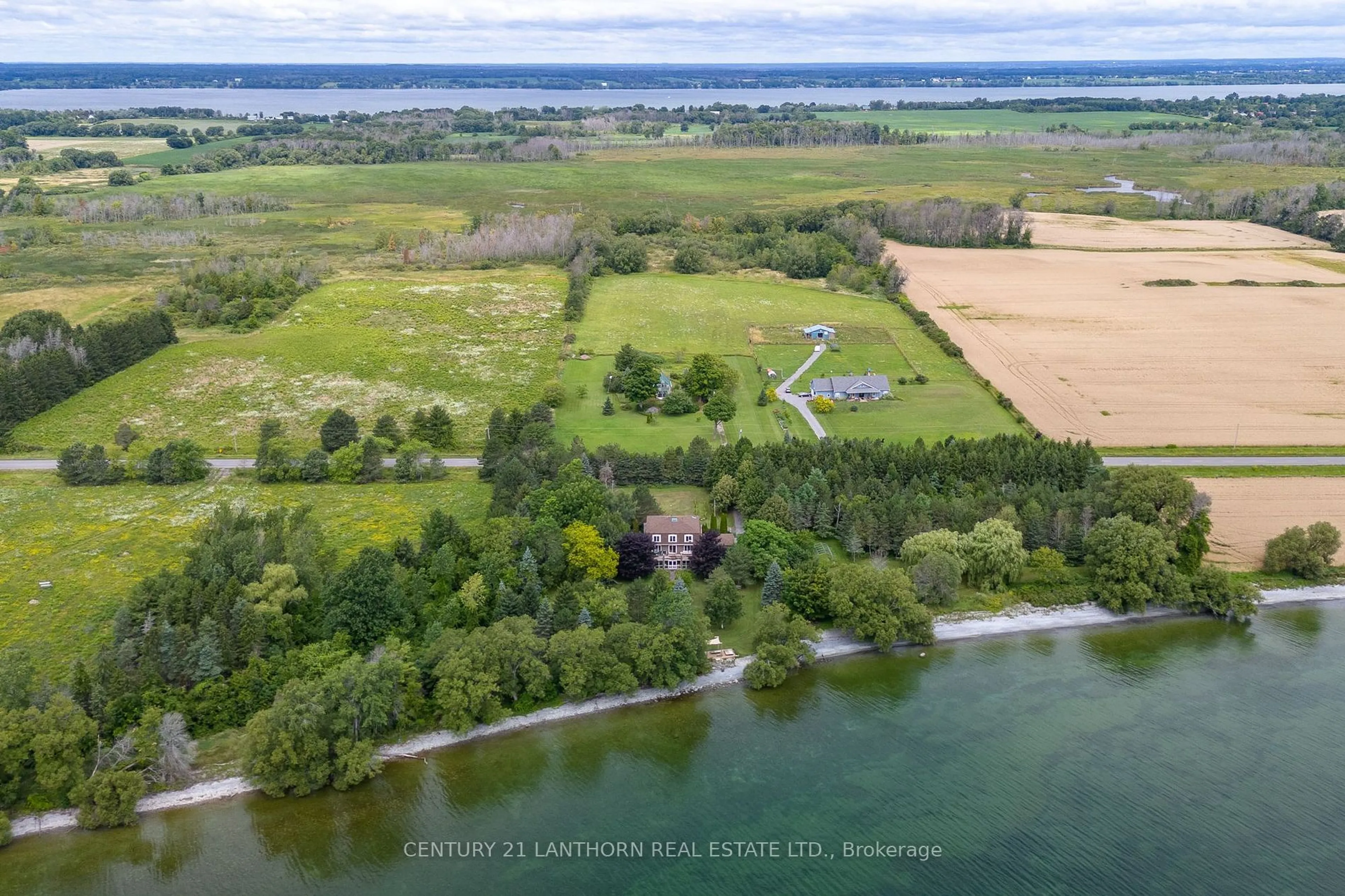 A pic from outside/outdoor area/front of a property/back of a property/a pic from drone, water/lake/river/ocean view for 4805 County Road 8 Rd, Prince Edward County Ontario K0K 2T0