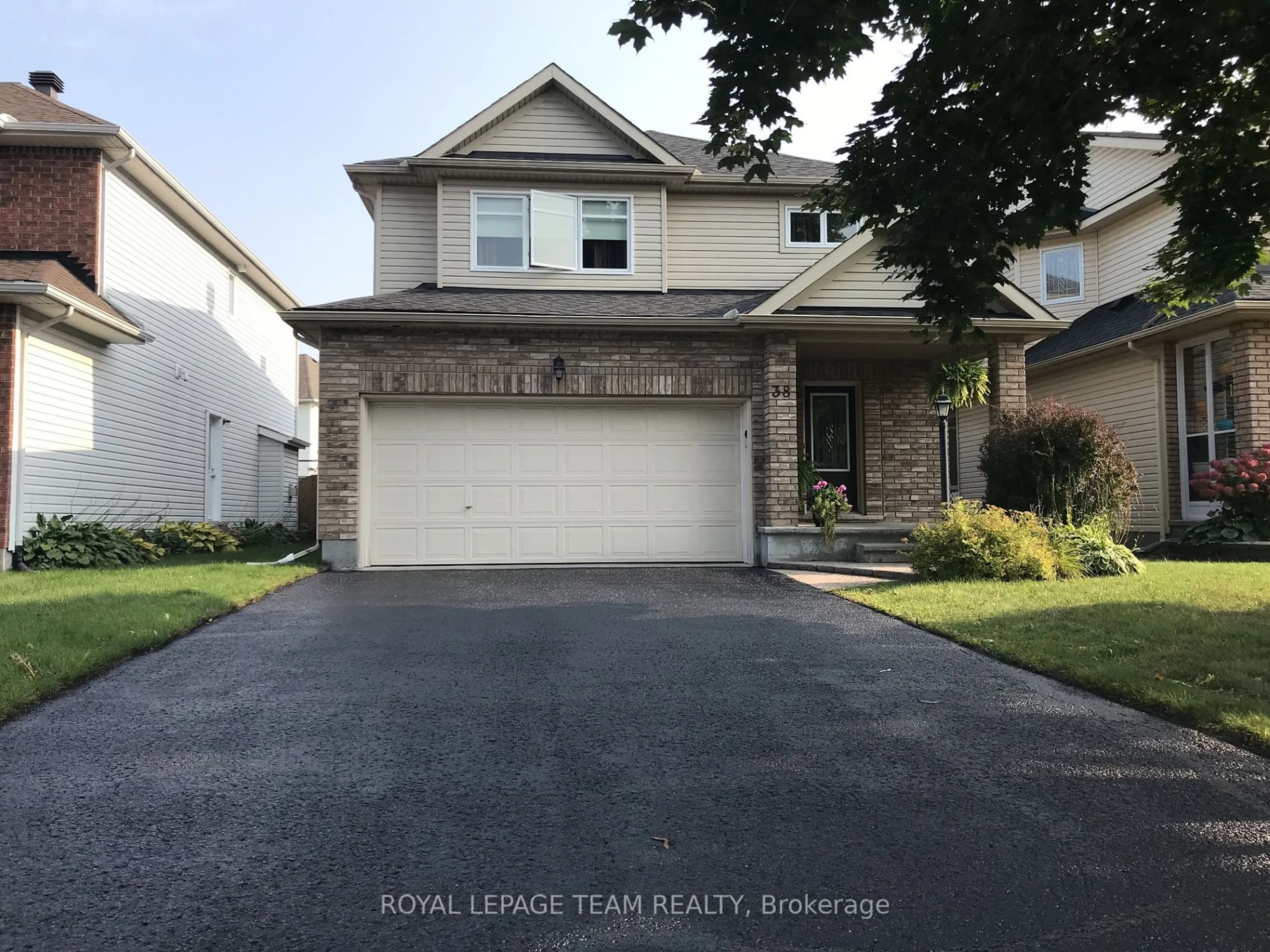 Home with vinyl exterior material, street for 38 Knowlton Dr, Barrhaven Ontario K2G 6V4