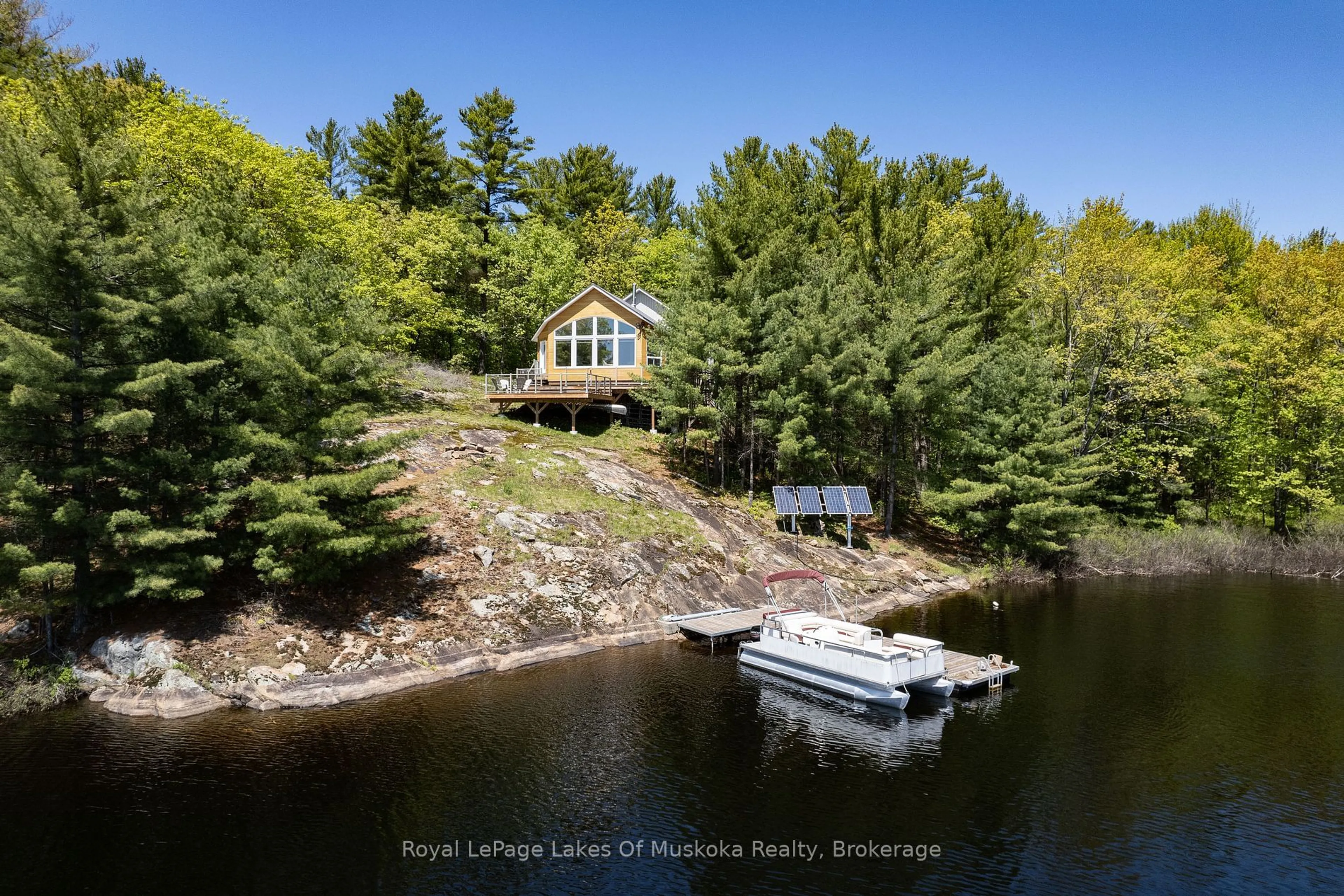 A pic from outside/outdoor area/front of a property/back of a property/a pic from drone, water/lake/river/ocean view for 22 Mile Island, Gravenhurst Ontario P0E 1G0