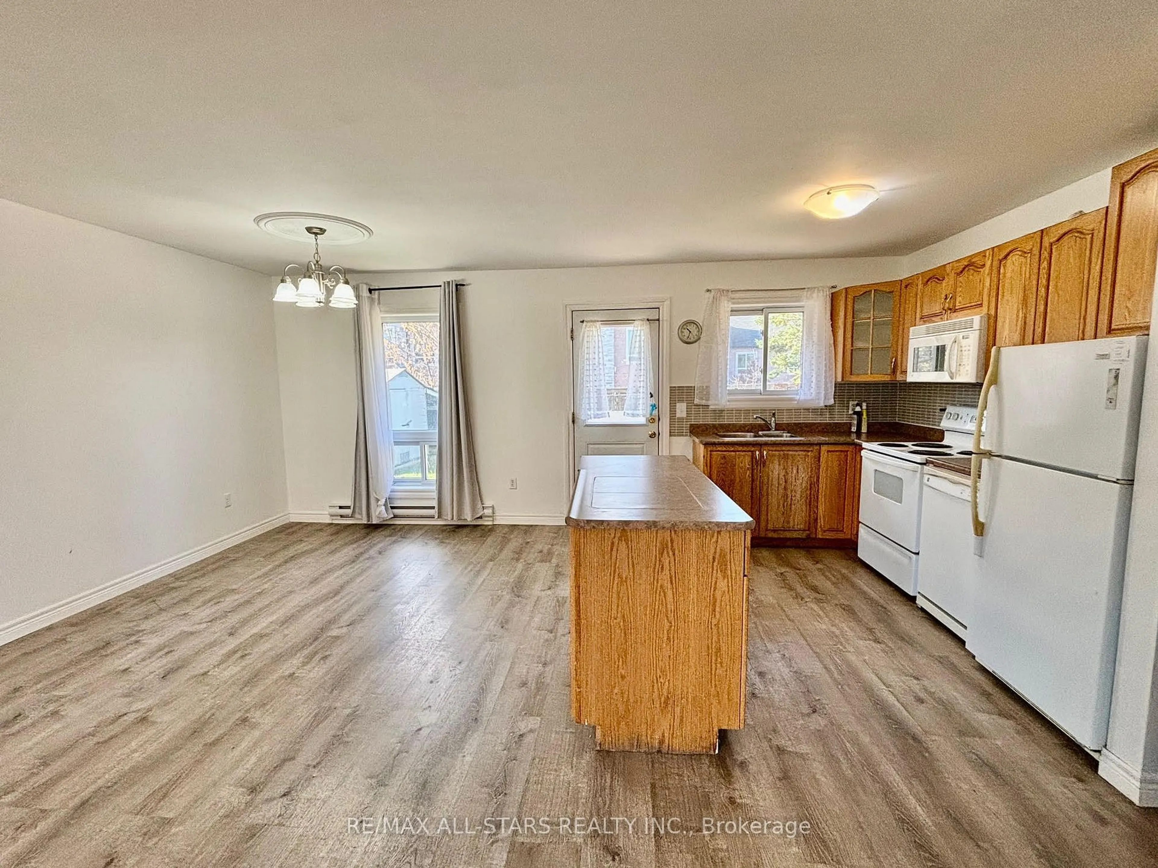 Open concept kitchen, wood/laminate floor for 3 Caroline St, Kawartha Lakes Ontario K9V 1T2