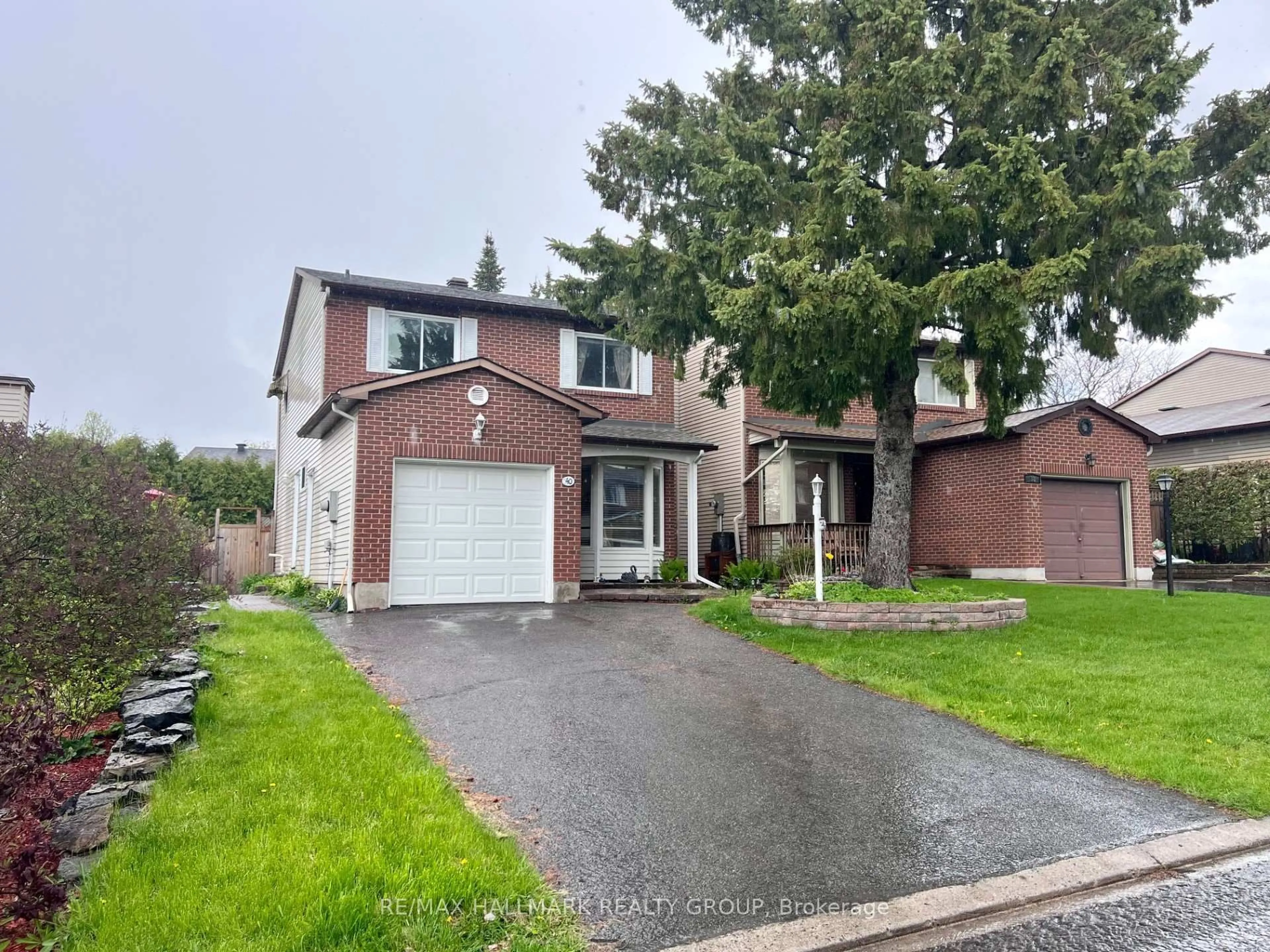 Home with brick exterior material, street for 40 Stable Way, Kanata Ontario K2M 1A6