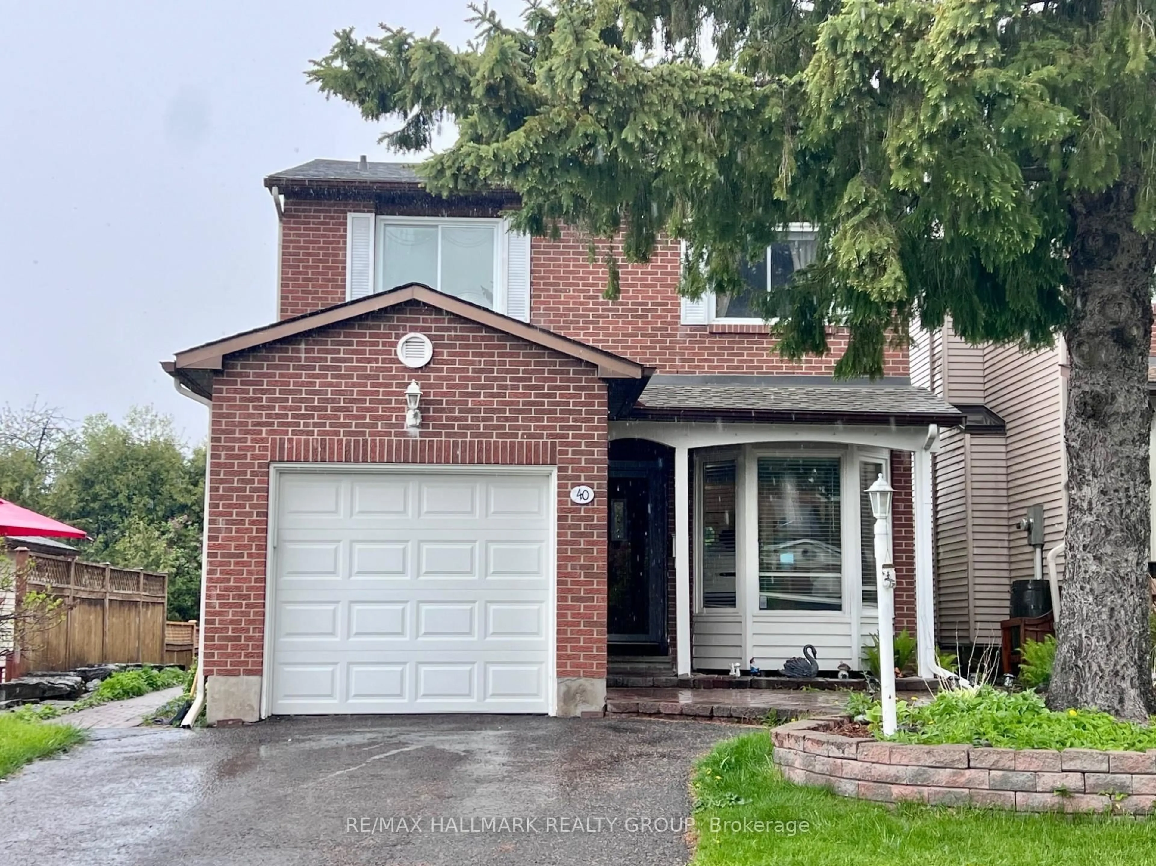 Home with brick exterior material, street for 40 Stable Way, Kanata Ontario K2M 1A6