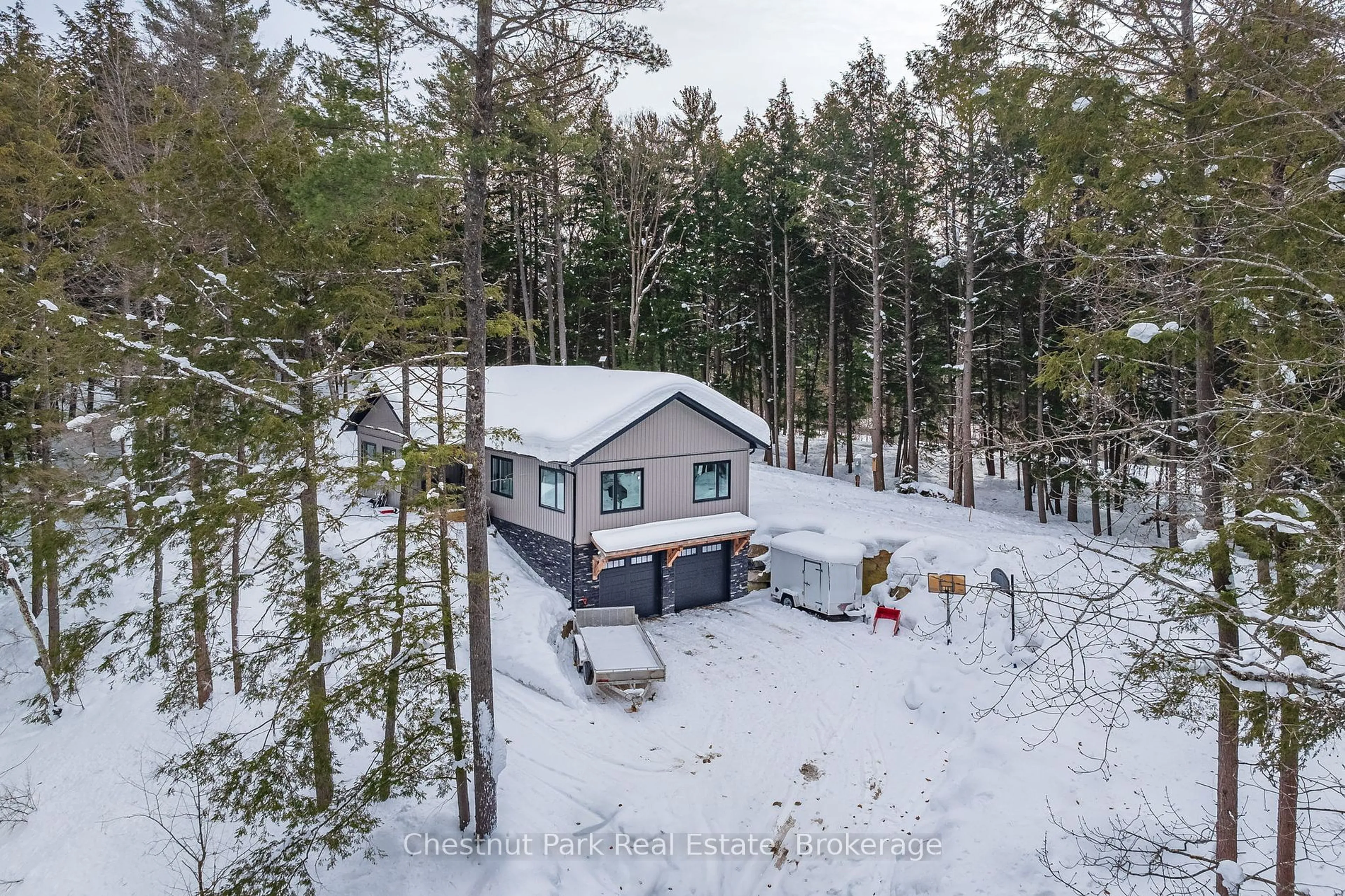 A pic from outside/outdoor area/front of a property/back of a property/a pic from drone, forest/trees view for 1010 Leonard Lake 1 Rd, Muskoka Lakes Ontario P1L 0M5