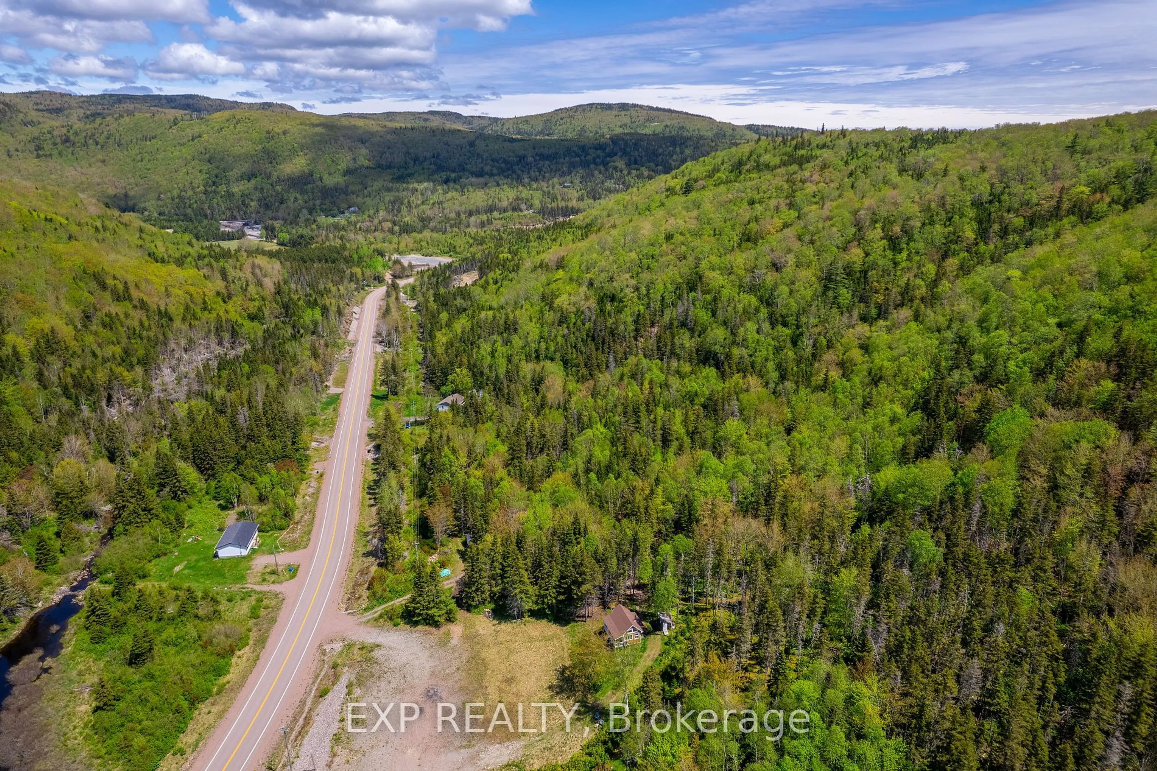 A pic from outside/outdoor area/front of a property/back of a property/a pic from drone, forest/trees view for 47403 Cabot Tr, Out of Area B0E 1B0