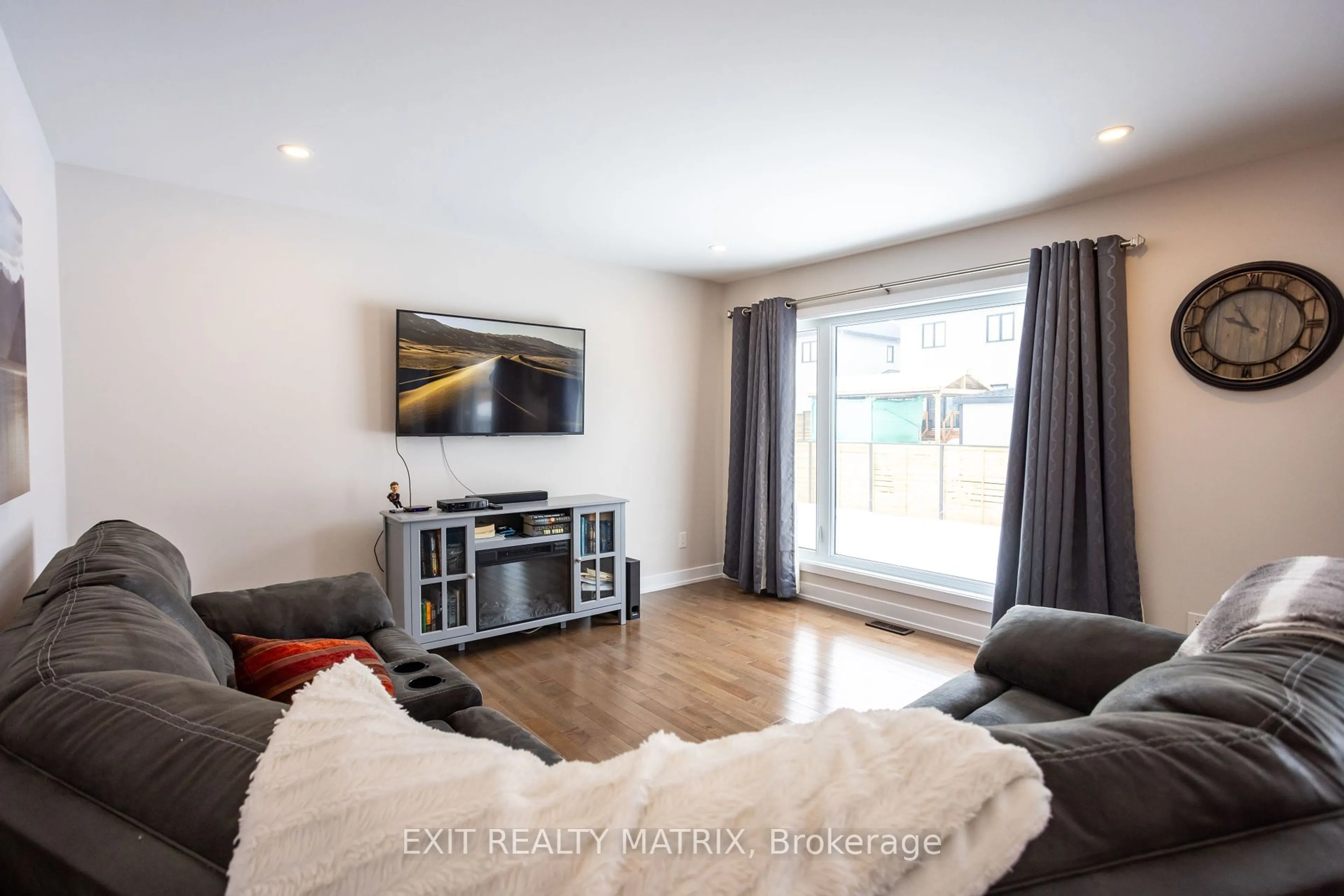 Living room with furniture, wood/laminate floor for 113 Argile St, The Nation Ontario K0A 1M0