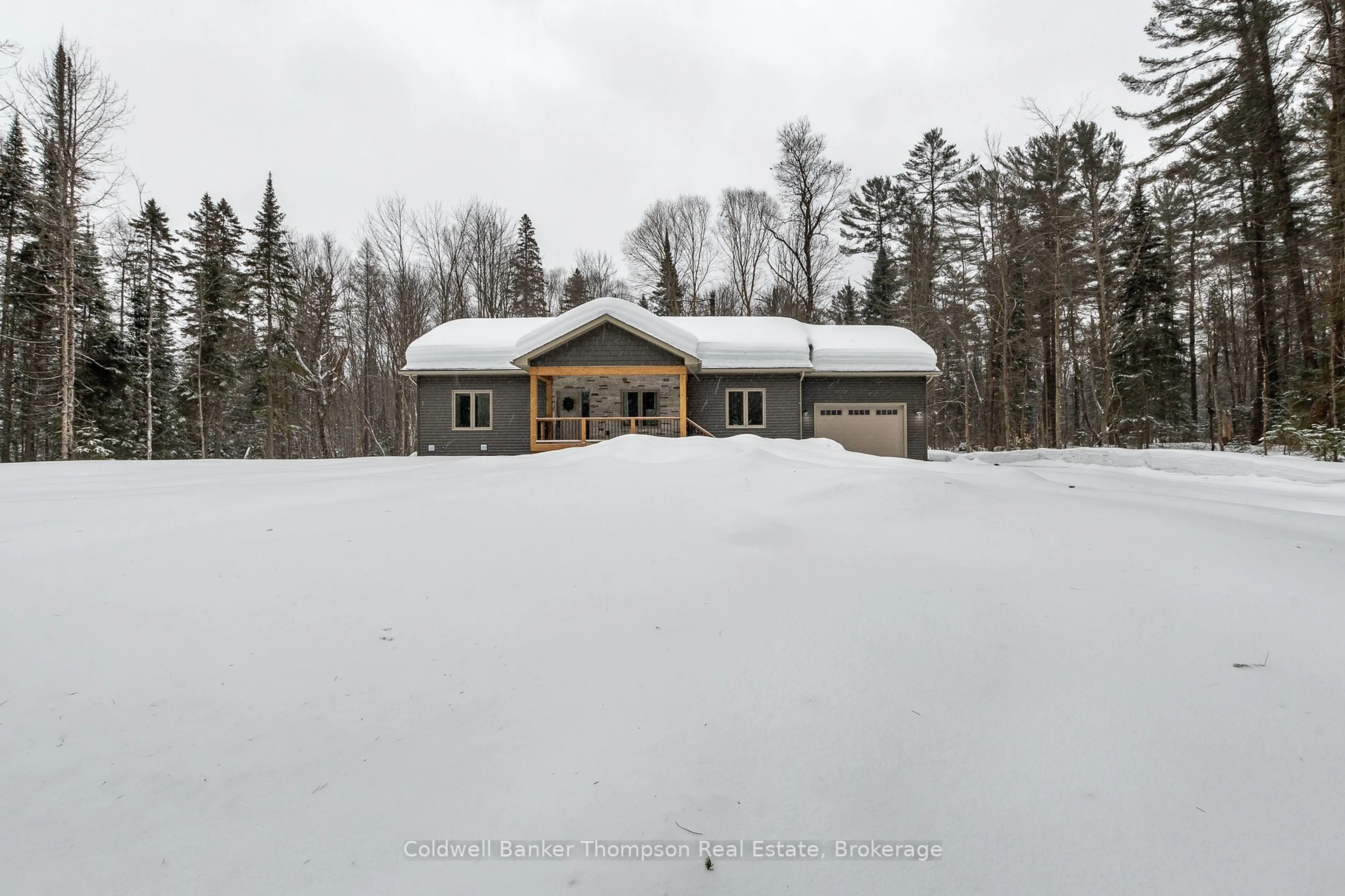 A pic from outside/outdoor area/front of a property/back of a property/a pic from drone, unknown for 807 Greer Rd, Huntsville Ontario P0B 1M0