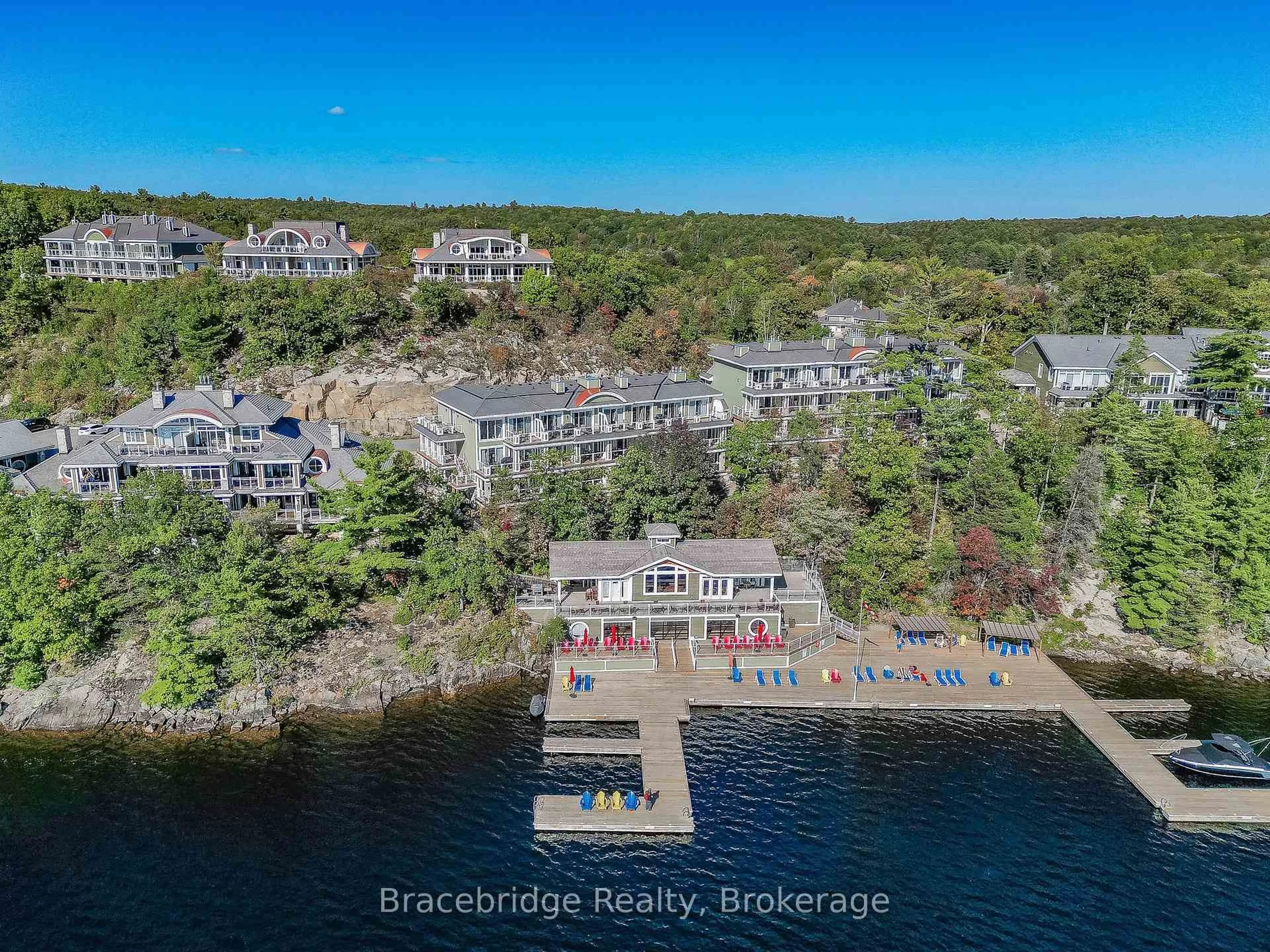 A pic from outside/outdoor area/front of a property/back of a property/a pic from drone, water/lake/river/ocean view for 1869 Muskoka 118 Rd #A102-D2, Muskoka Lakes Ontario P1L 1W8