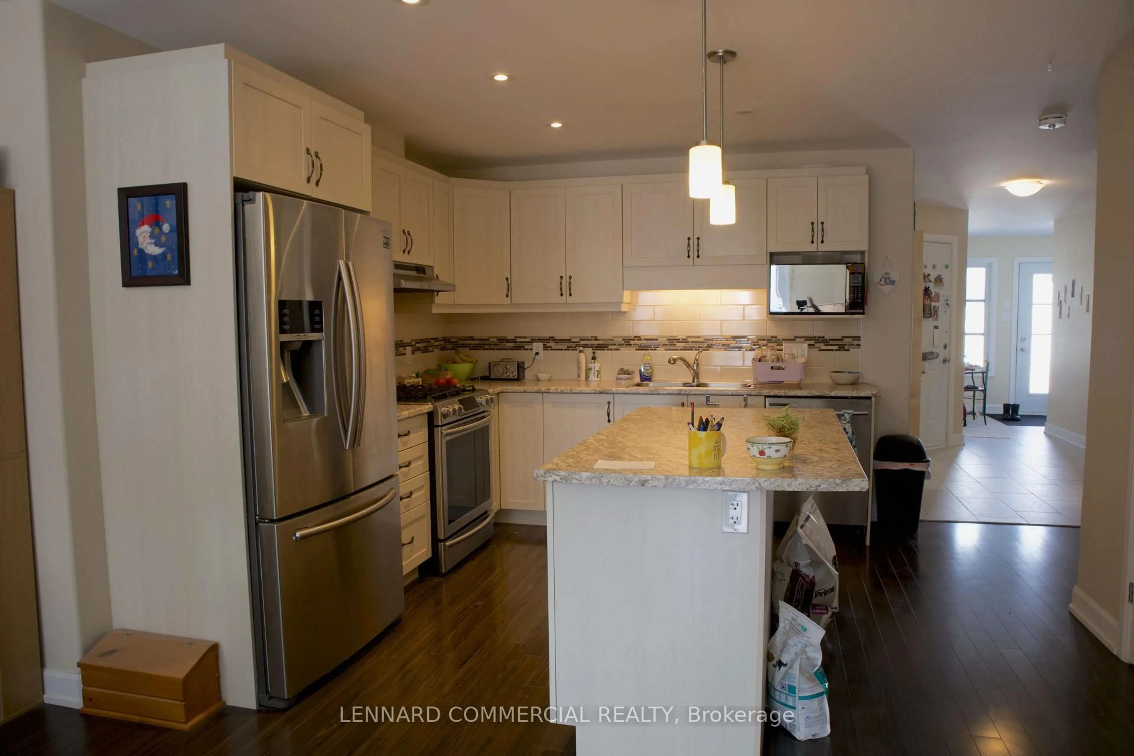 Open concept kitchen, wood/laminate floor for 398 Twilight Ave, Russell Ontario K4R 0E7