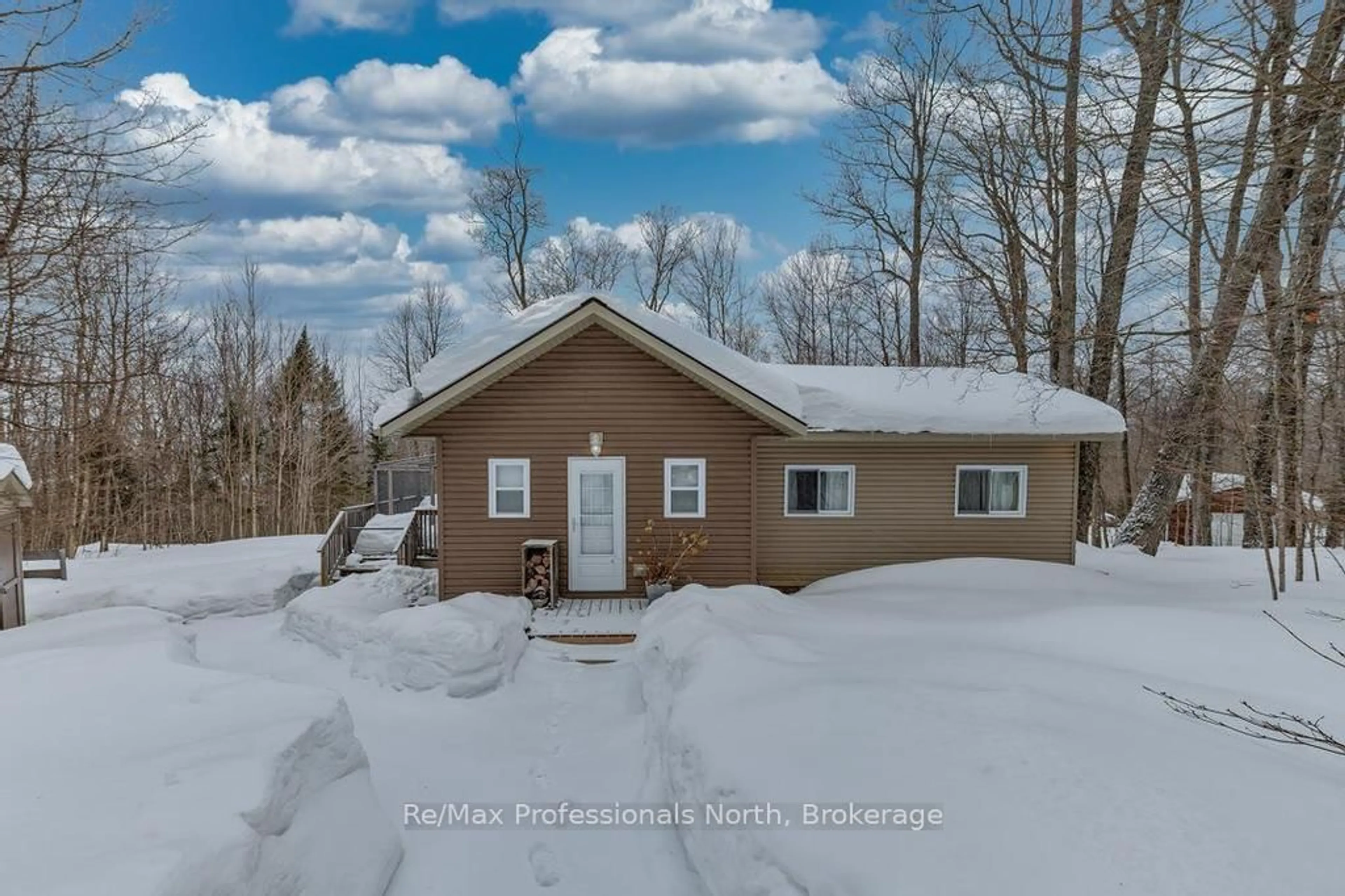 A pic from outside/outdoor area/front of a property/back of a property/a pic from drone, water/lake/river/ocean view for 1145 Chelsea Lane, Algonquin Highlands Ontario K0M 1J1