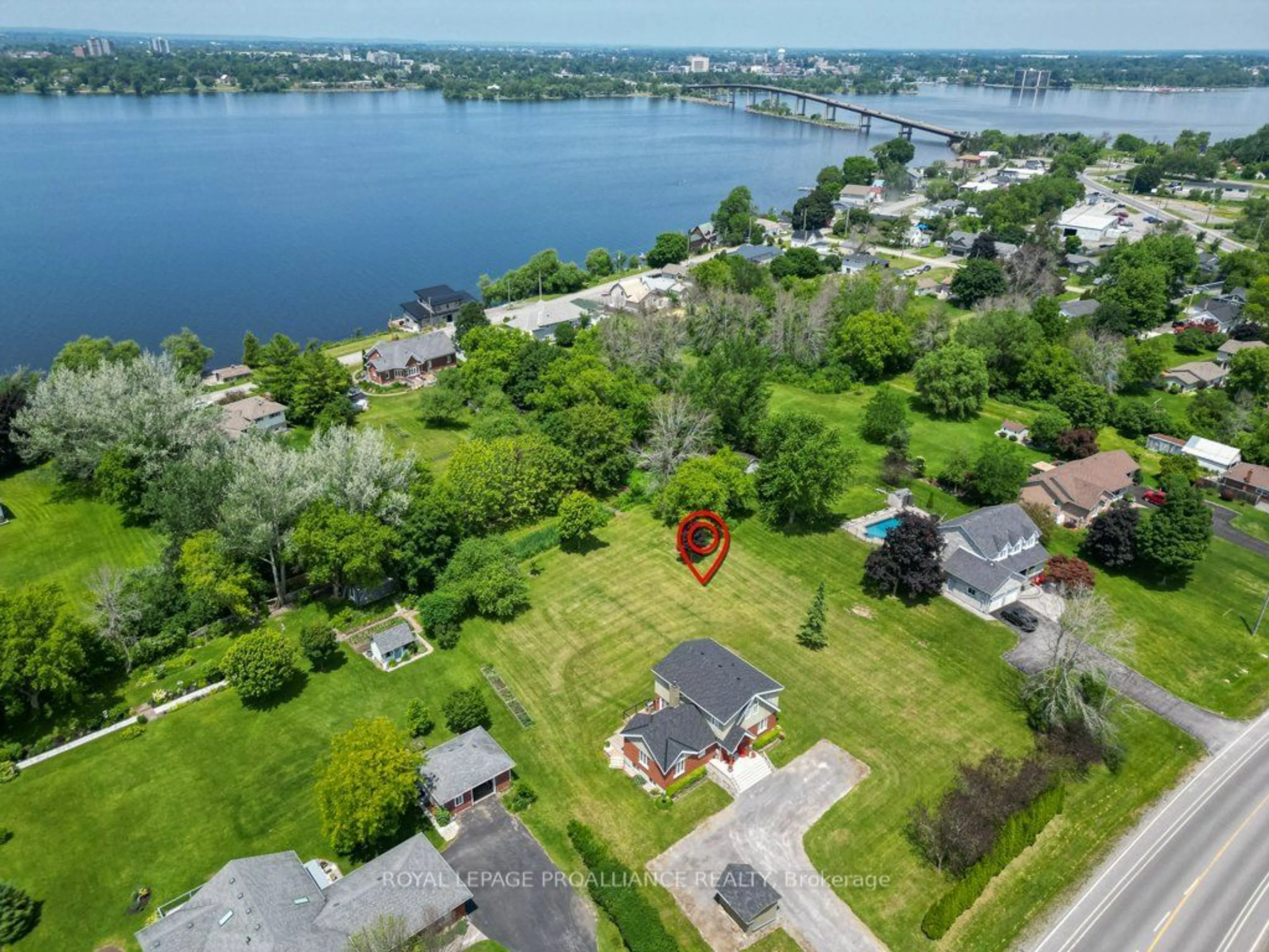 A pic from outside/outdoor area/front of a property/back of a property/a pic from drone, water/lake/river/ocean view for 144 County Road 3, Prince Edward County Ontario K8N 4Z7