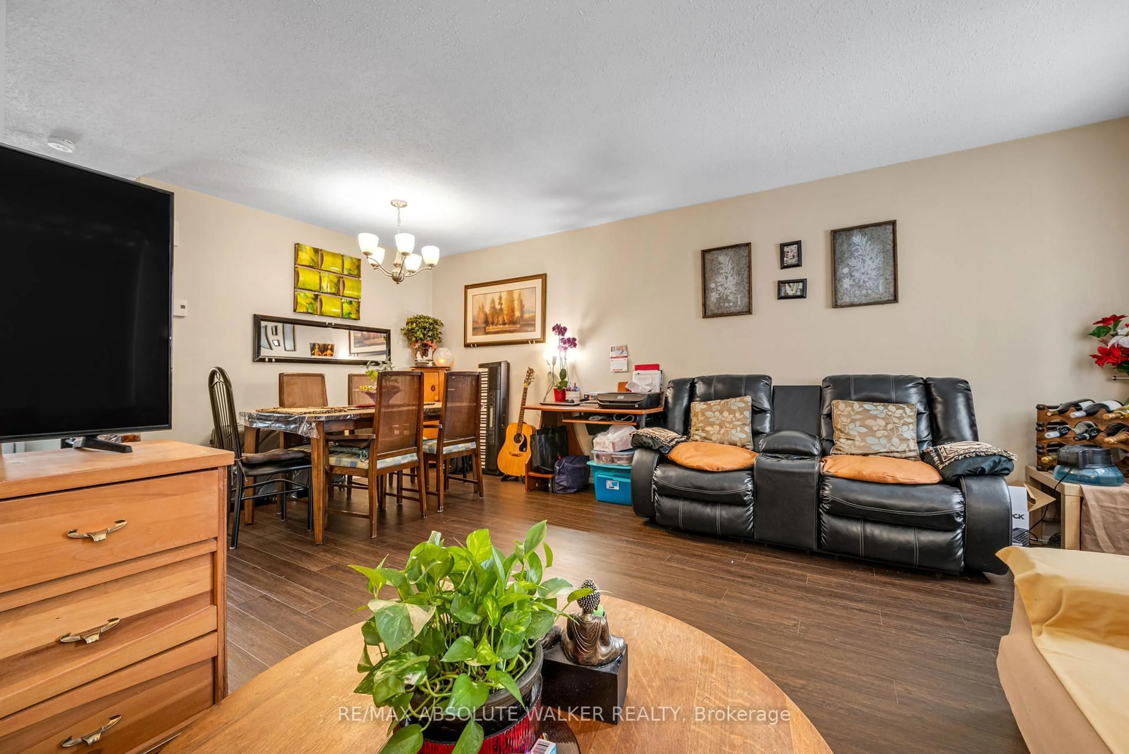 Living room with furniture, wood/laminate floor for 25A Sonnet Cres, Bells Corners and South to Fallowfield Ontario K2H 8W8