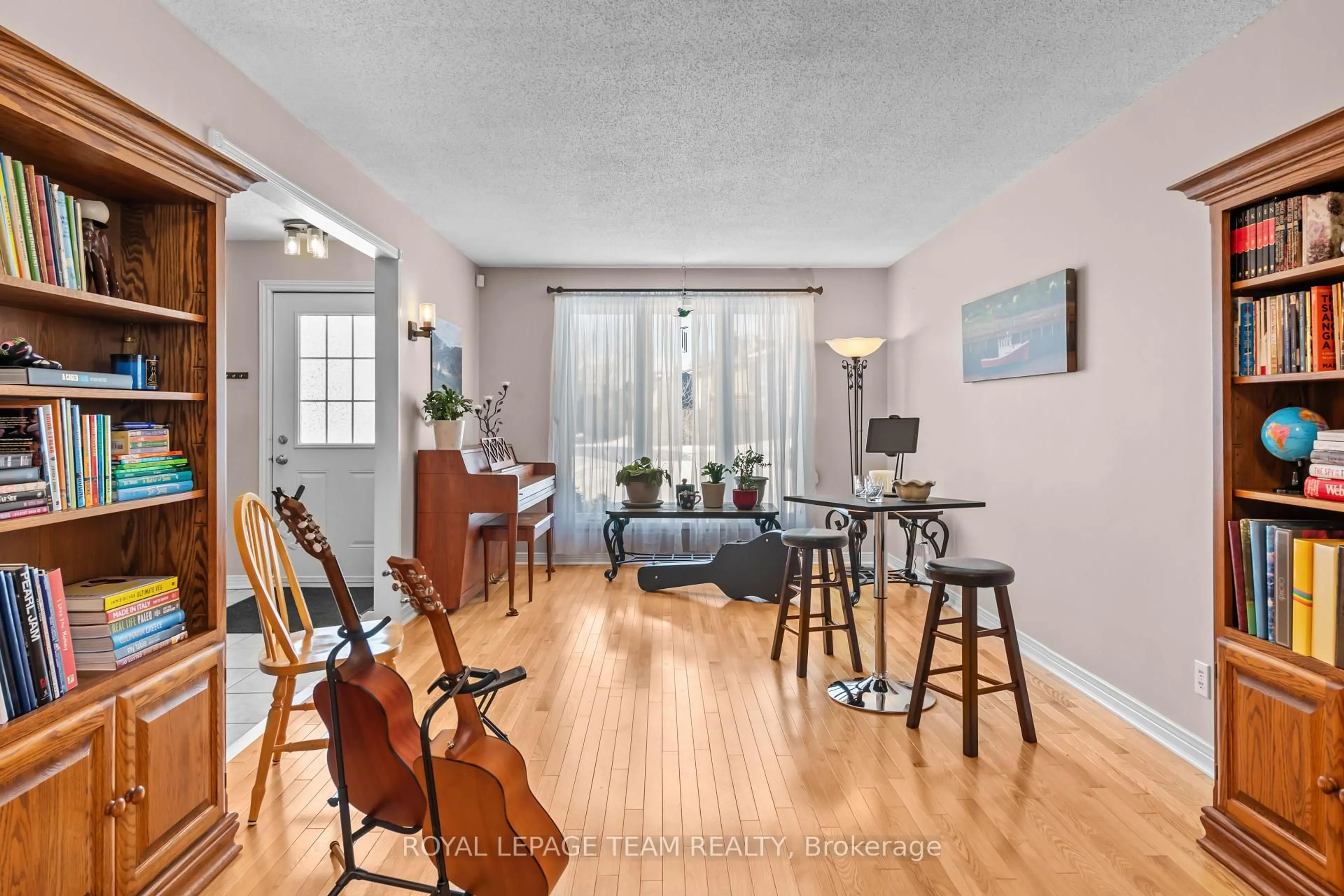 Living room with furniture, wood/laminate floor for 37 IvyLea St, South of Baseline to Knoxdale Ontario K2G 4X1