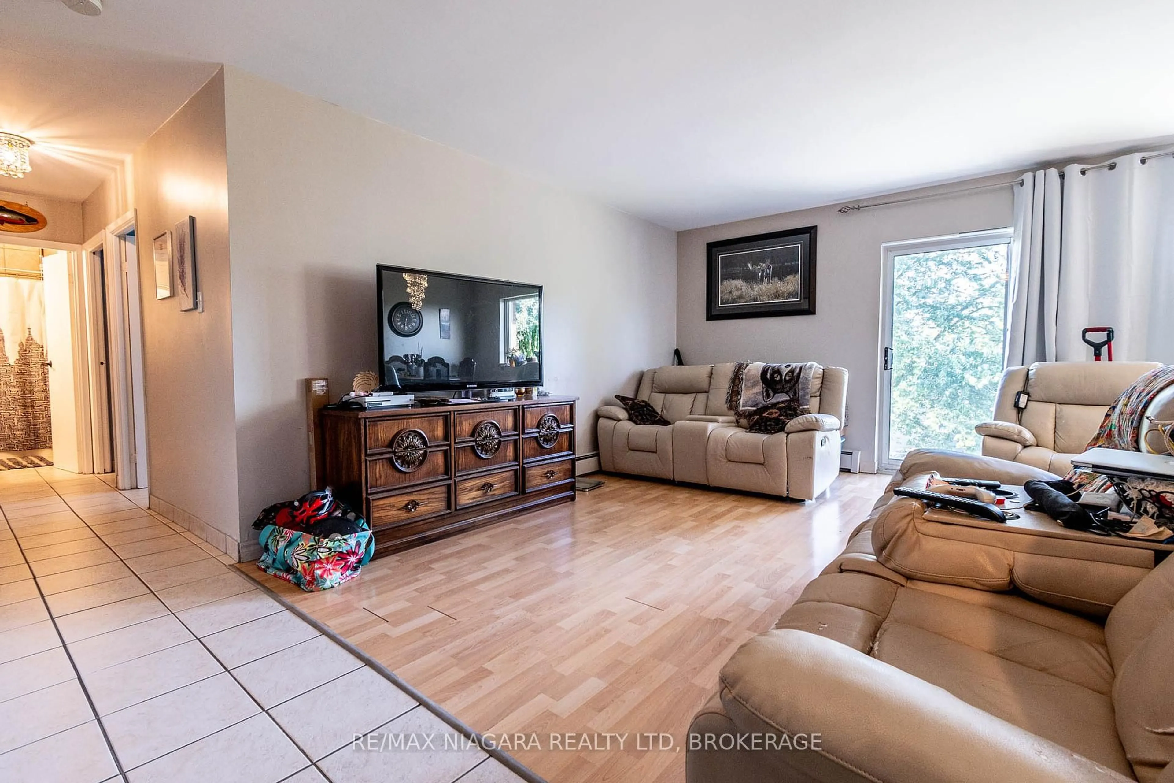 Living room with furniture, unknown for 242 OAKDALE Ave #317, St. Catharines Ontario L2P 3K5