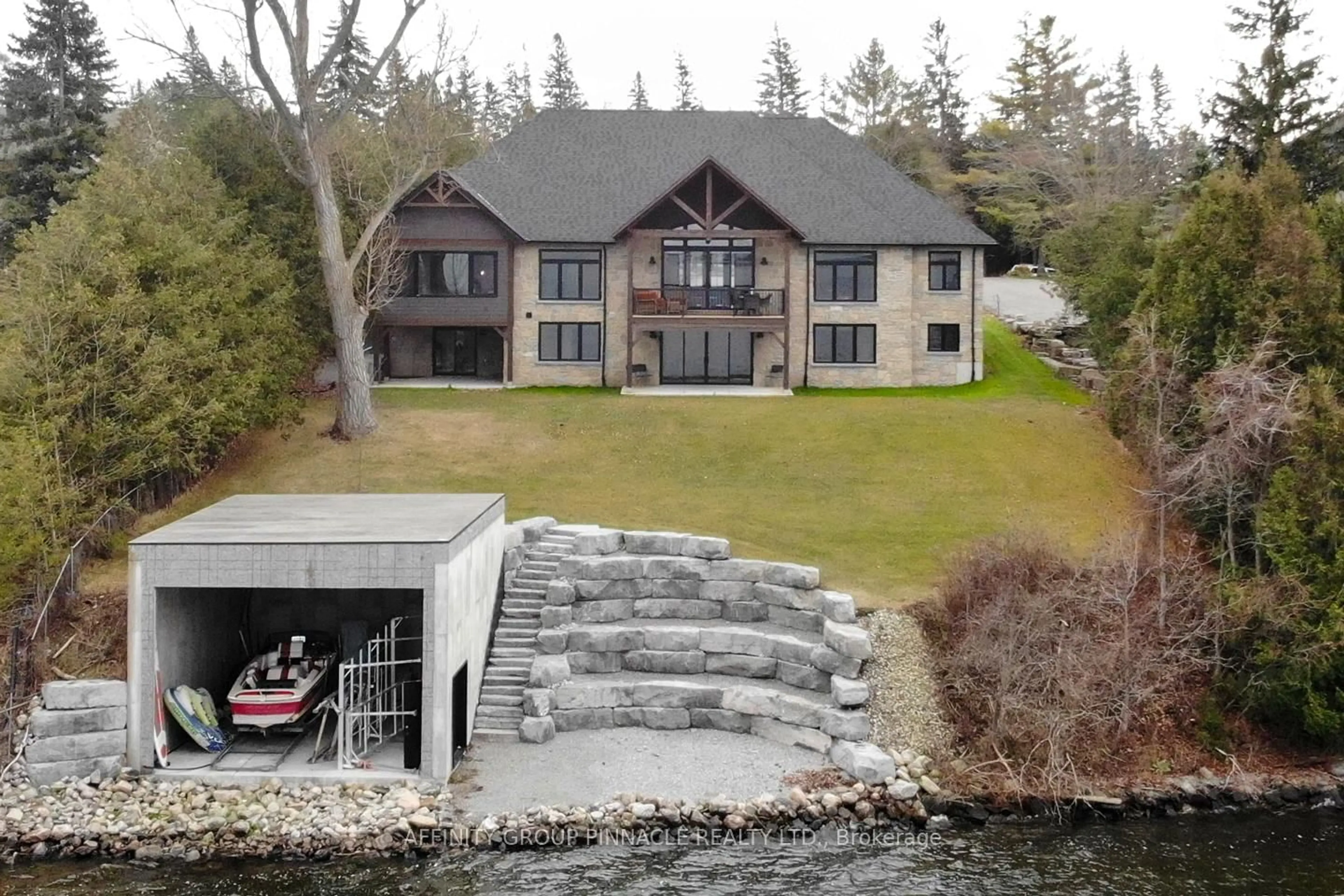 A pic from outside/outdoor area/front of a property/back of a property/a pic from drone, water/lake/river/ocean view for 383 Snug Harbour Rd, Kawartha Lakes Ontario K9V 4R6