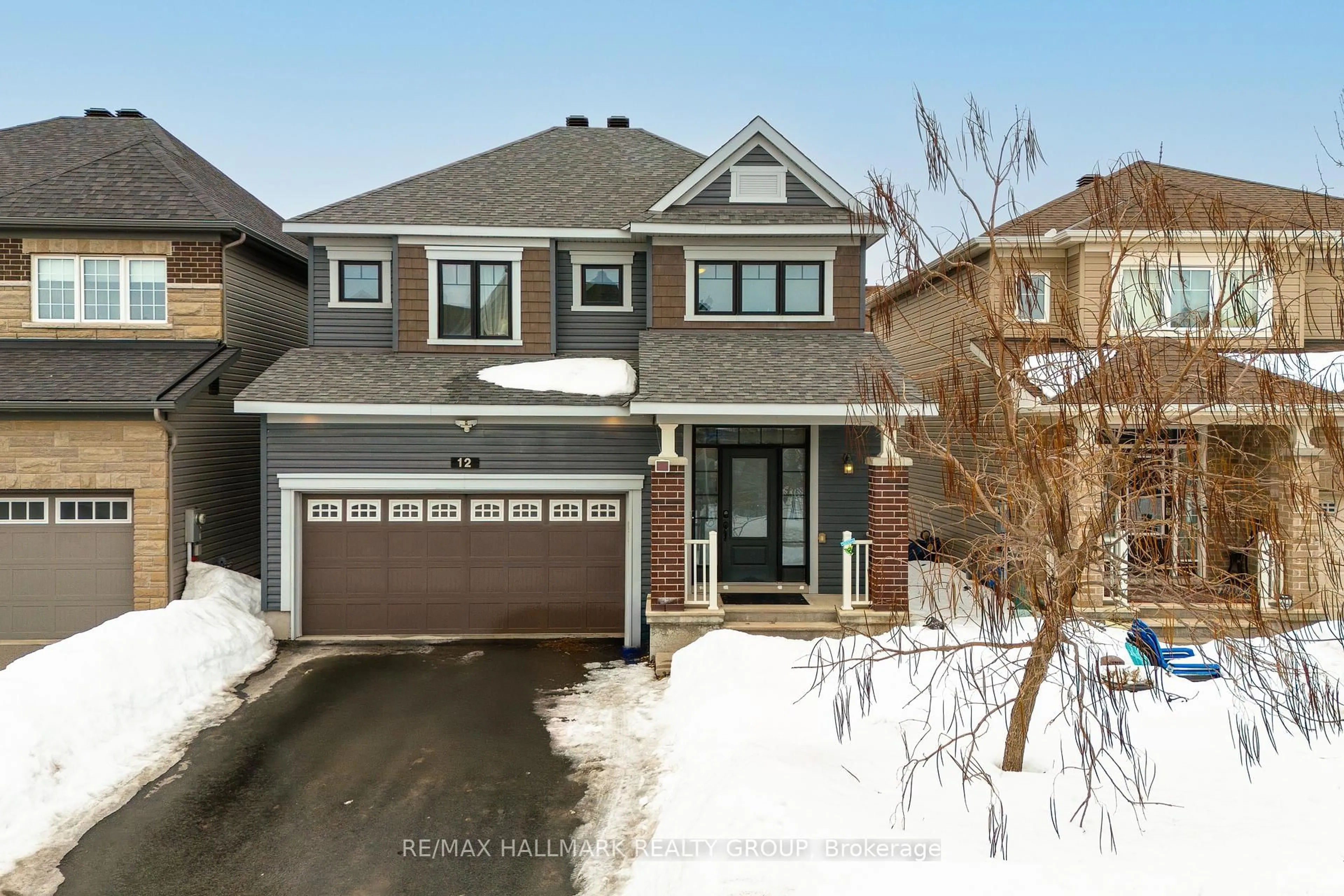 Home with brick exterior material, street for 12 Knockaderry Cres, Barrhaven Ontario K2C 3H2