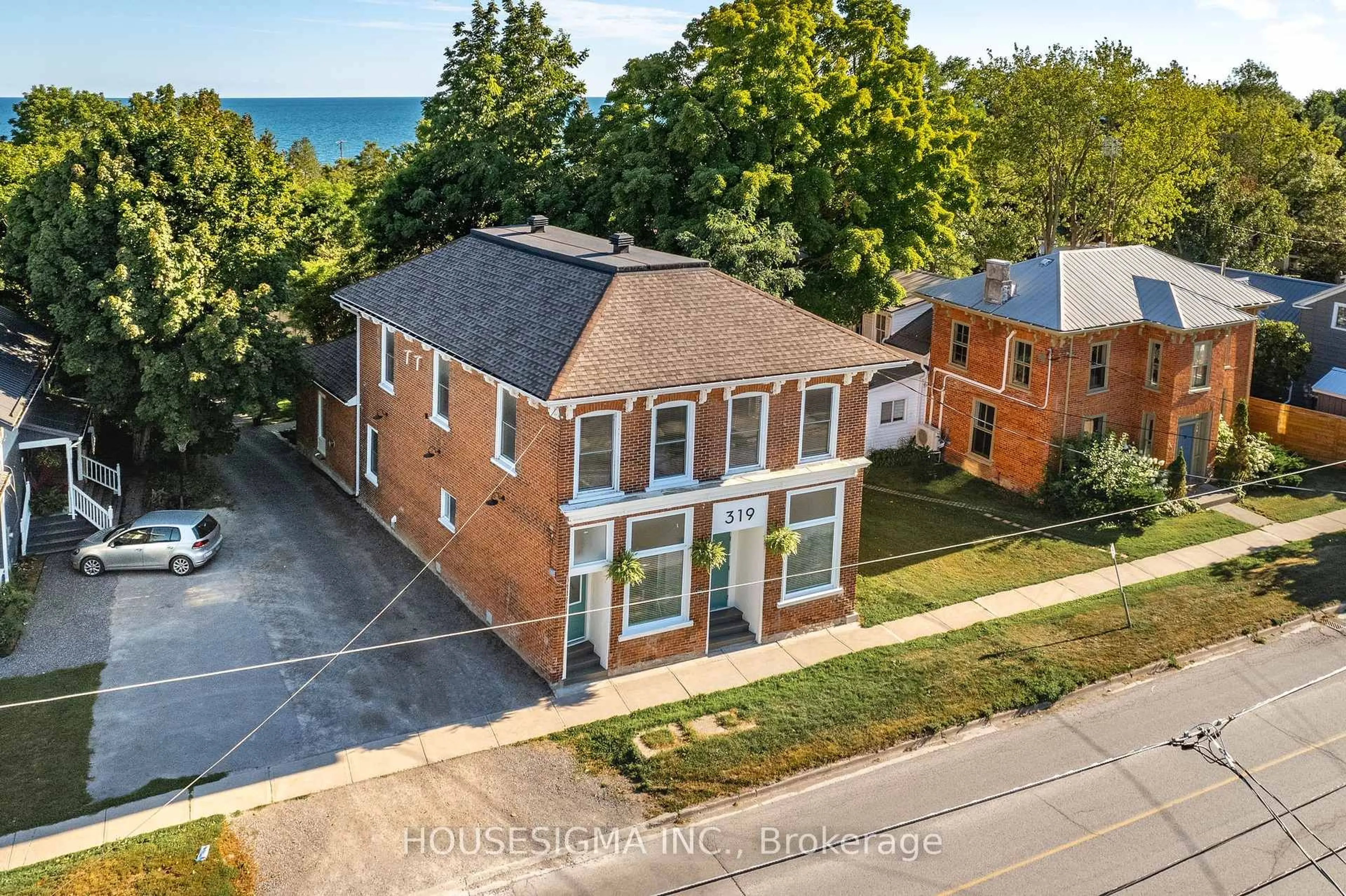 A pic from outside/outdoor area/front of a property/back of a property/a pic from drone, street for 319 Main St, Prince Edward County Ontario K0K 3L0