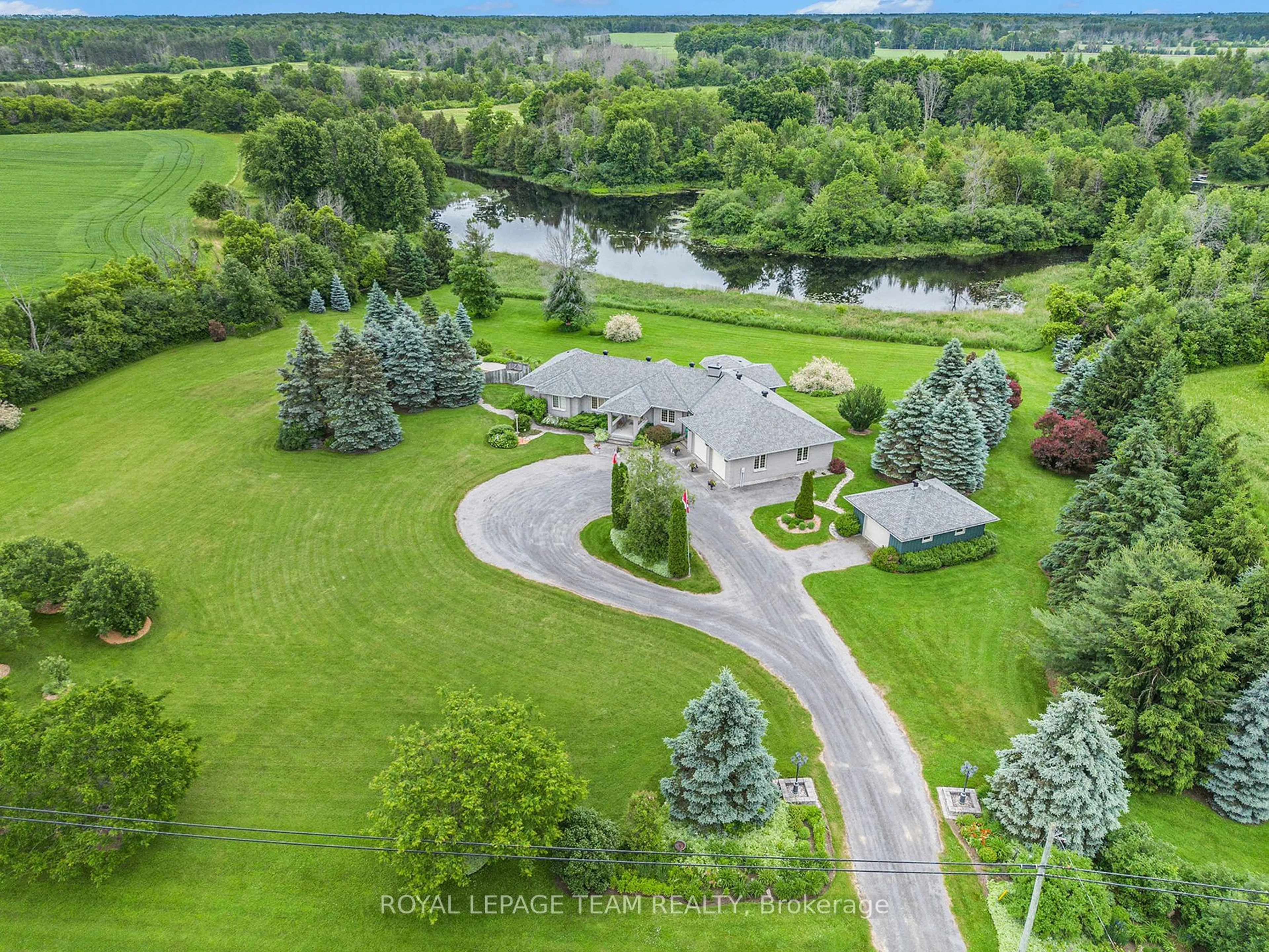 A pic from outside/outdoor area/front of a property/back of a property/a pic from drone, water/lake/river/ocean view for 2124 Cty Rd 18 Rd, North Grenville Ontario K0G 1J0