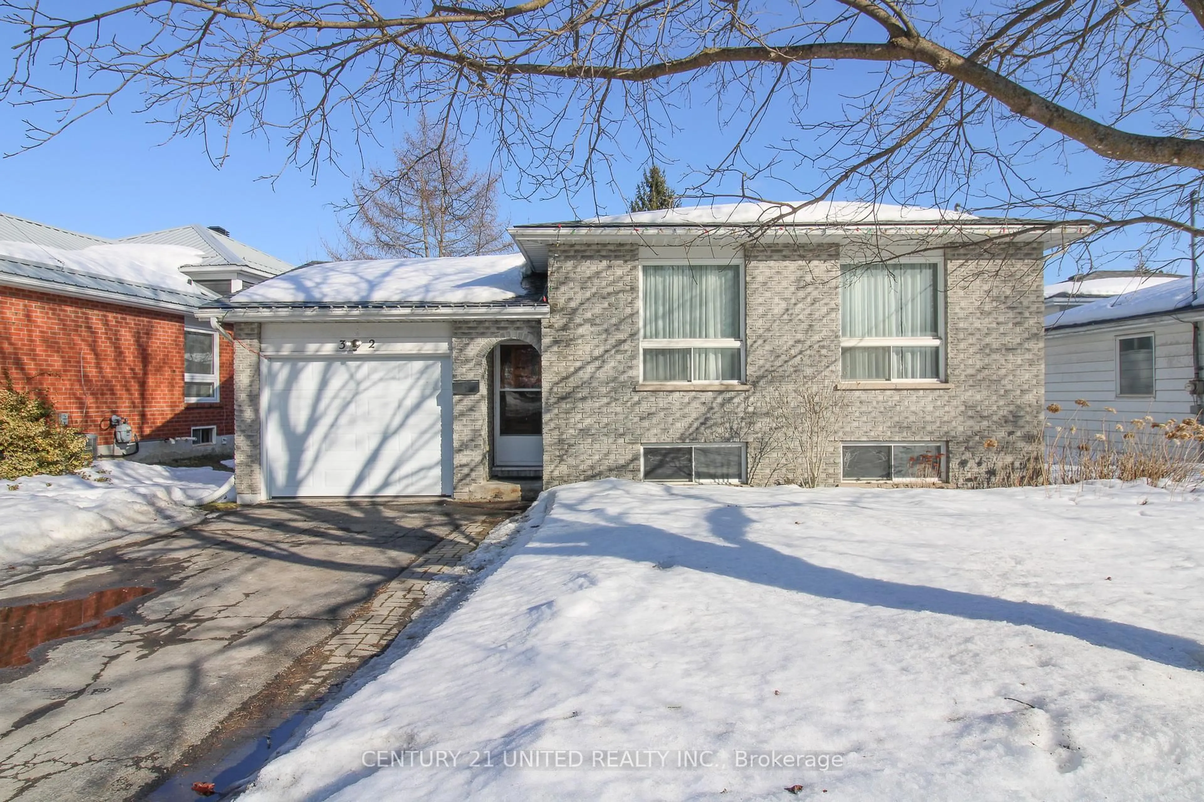 Home with brick exterior material, street for 32 Kawartha Heights Blvd, Peterborough Ontario K9J 8B3