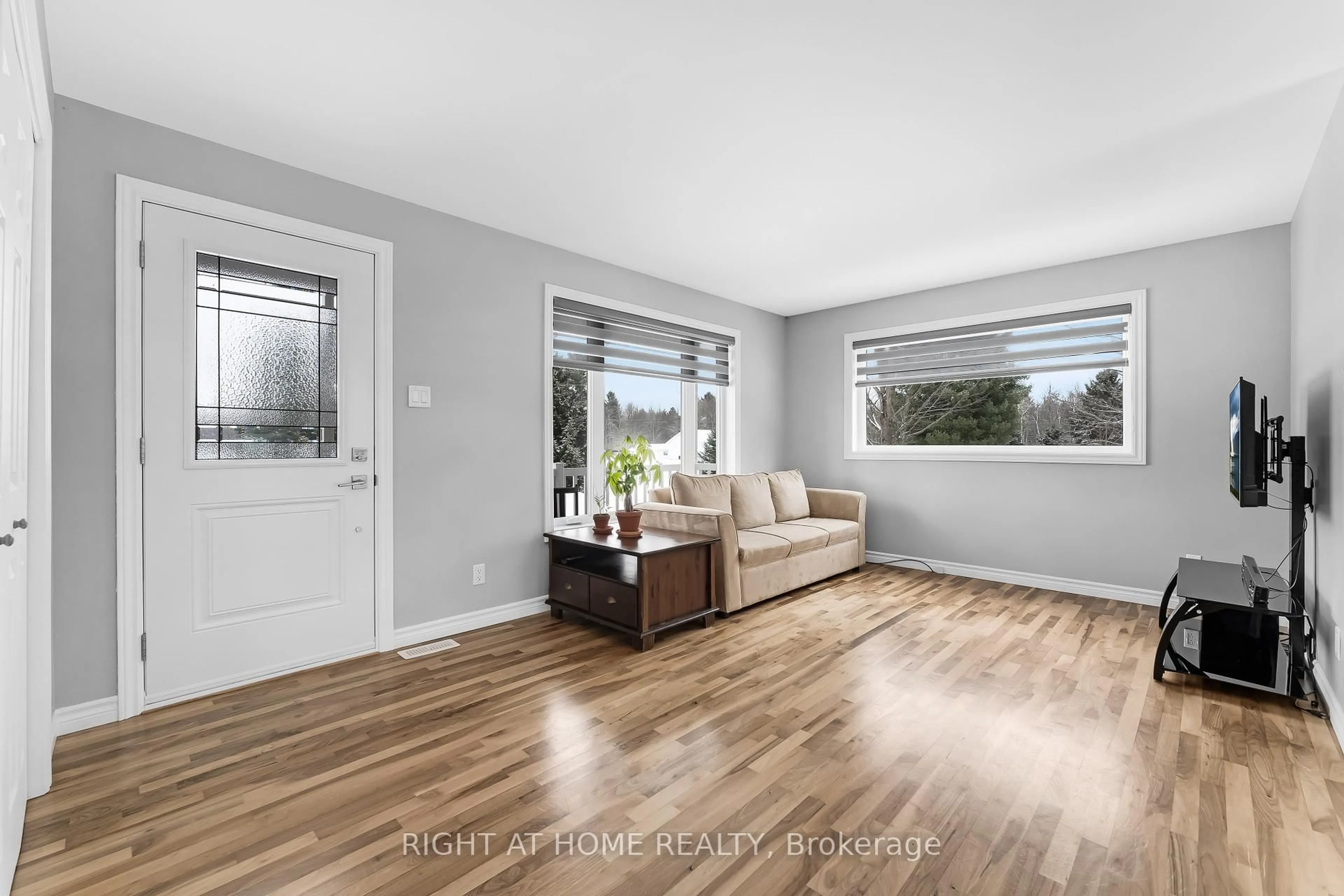 Living room with furniture, wood/laminate floor for 2874 Dixon Factory Rd, Casselman Ontario K0A 1M0