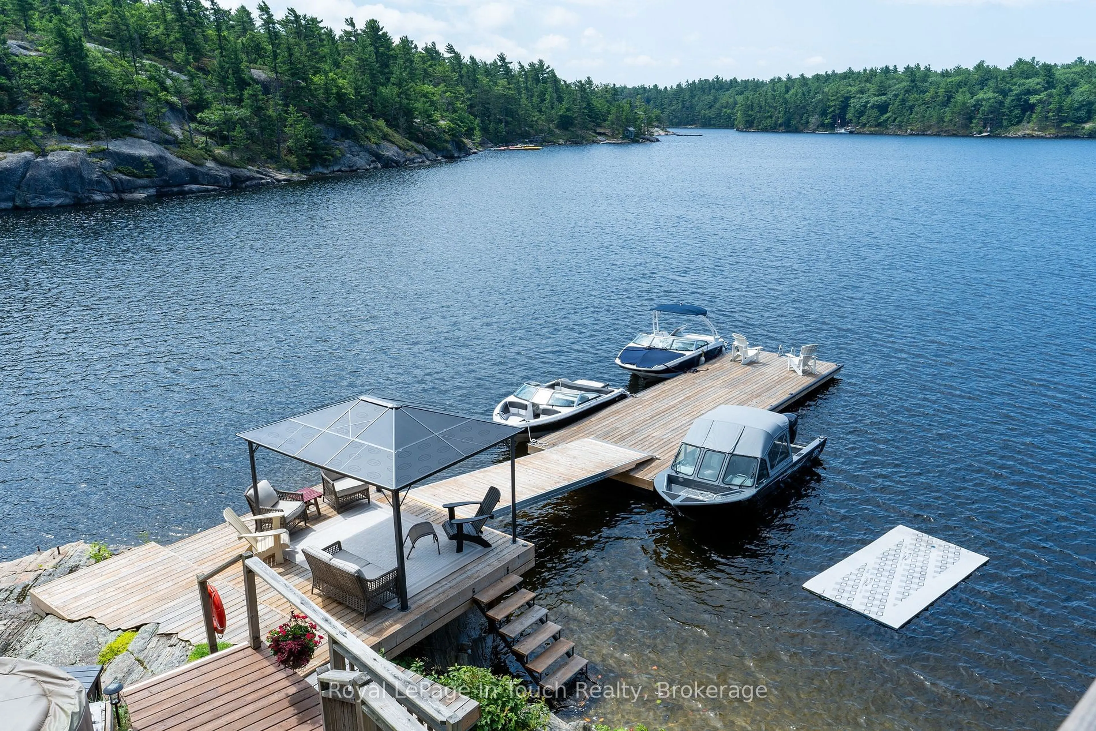 A pic from outside/outdoor area/front of a property/back of a property/a pic from drone, water/lake/river/ocean view for 18588 Georgian Bay Shore, Georgian Bay Ontario P0E 1E0