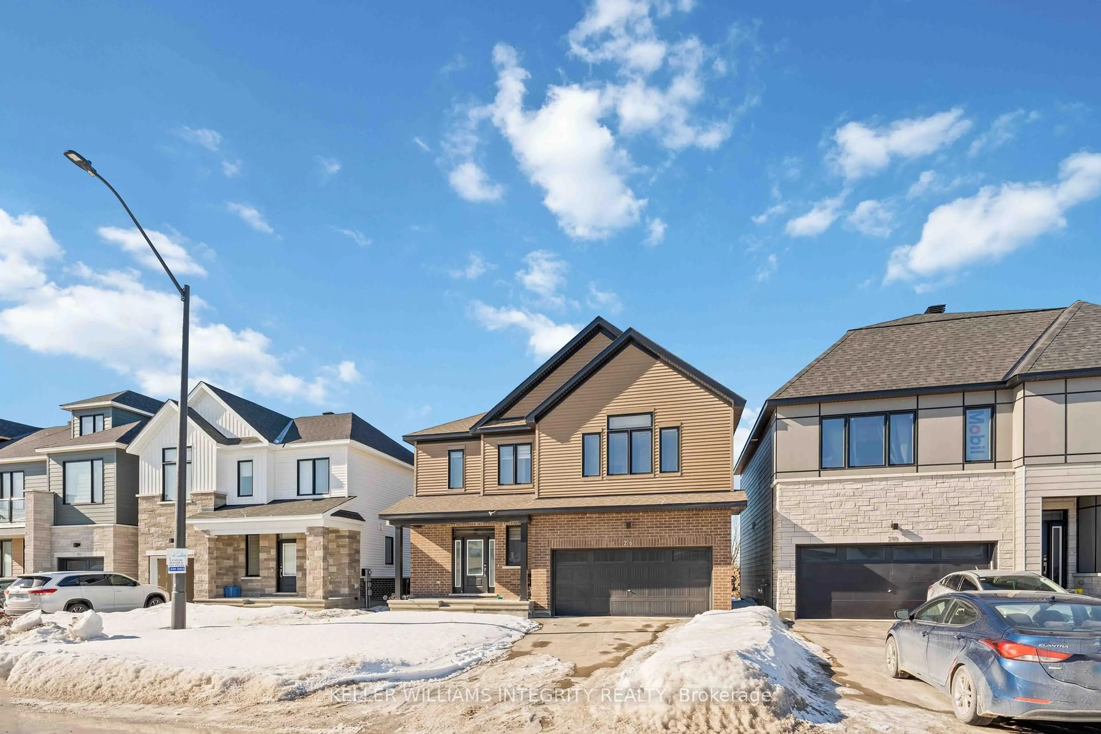 Home with brick exterior material, street for 216 Conservancy Dr, Barrhaven Ontario K2J 7M5